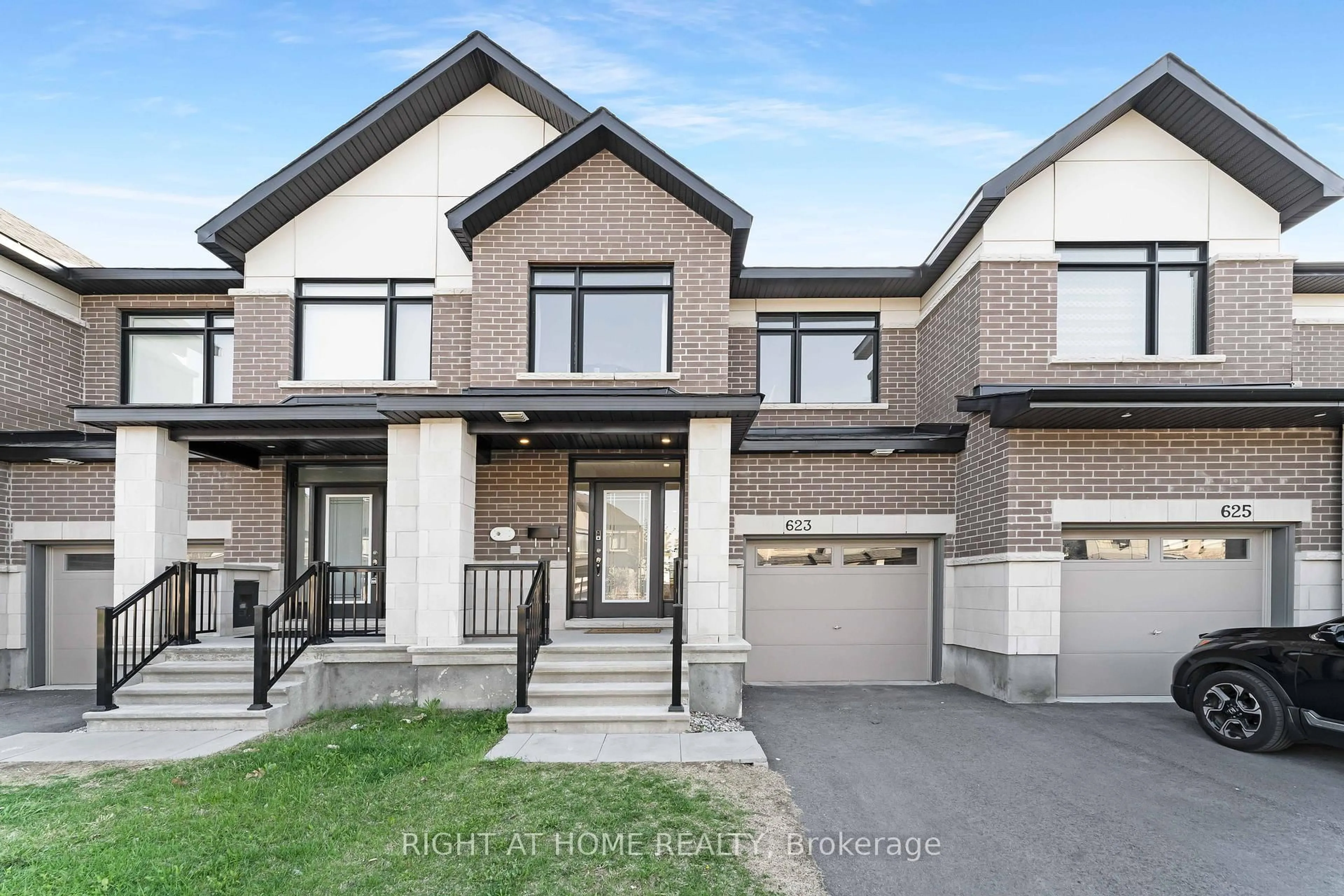 Home with brick exterior material, street for 623 Rathburn Lane, Ottawa Ontario K1T 0V7