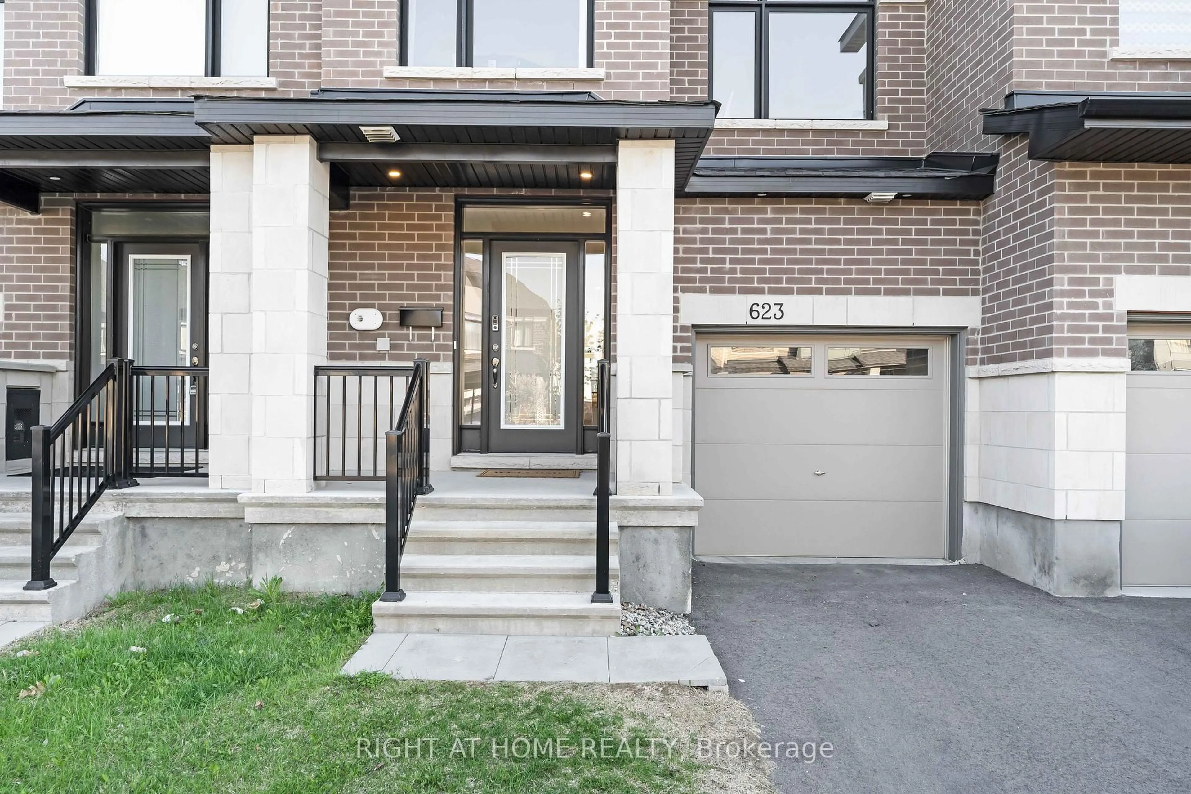 Home with brick exterior material, street for 623 Rathburn Lane, Ottawa Ontario K1T 0V7