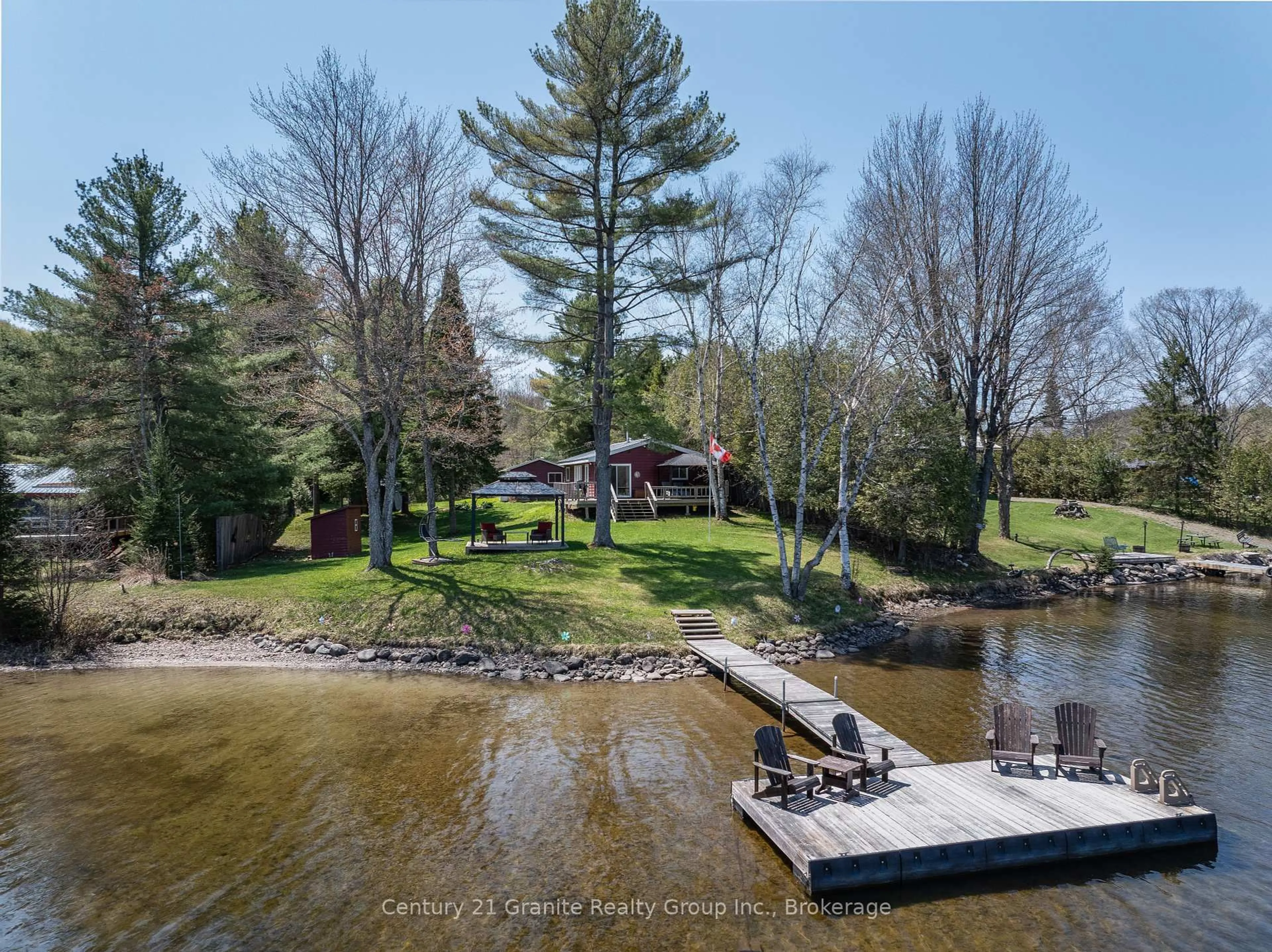 A pic from outside/outdoor area/front of a property/back of a property/a pic from drone, water/lake/river/ocean view for 1018 Shamrock Lane, Dysart et al Ontario K0M 1S0