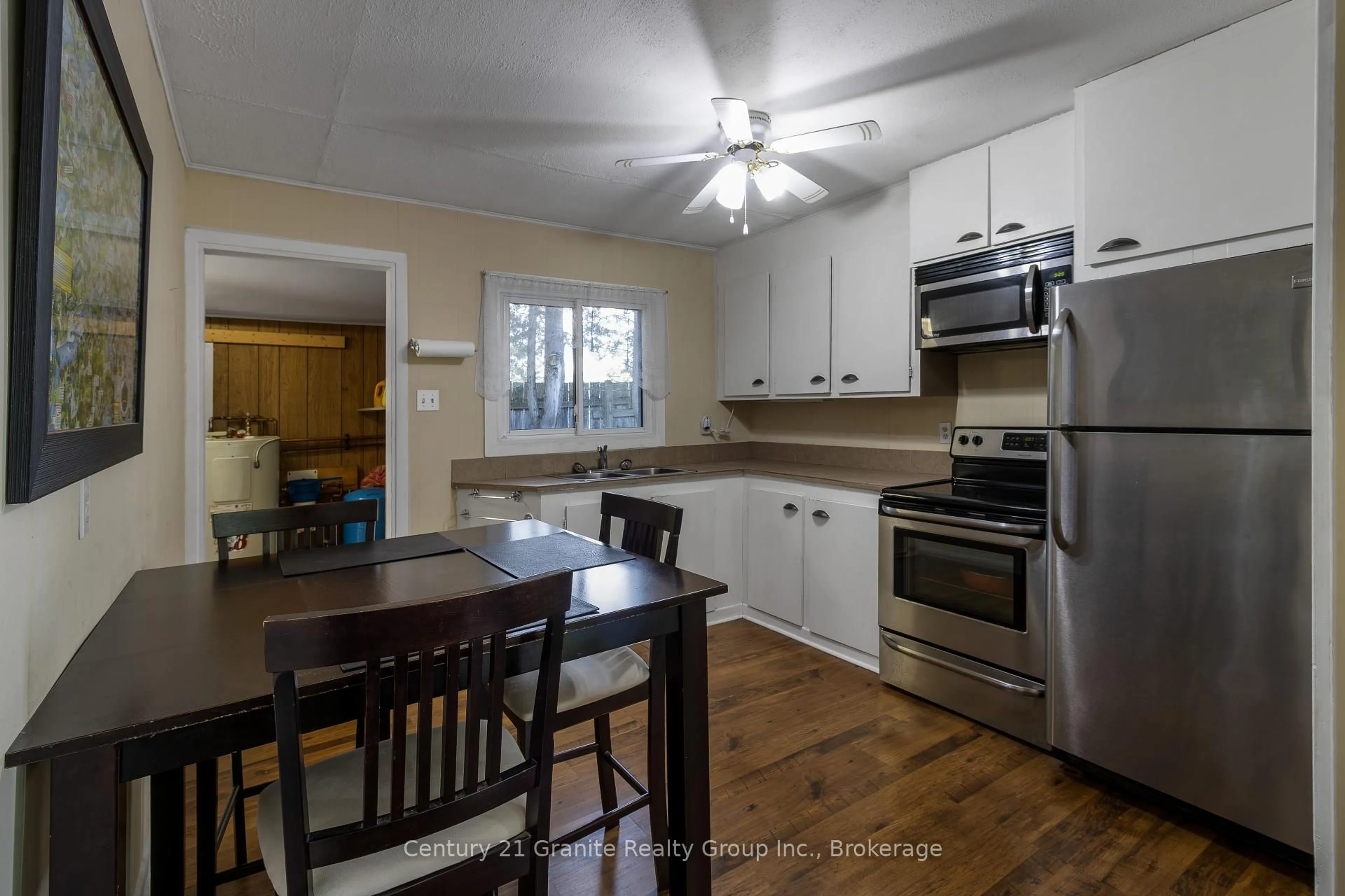 Open concept kitchen, wood/laminate floor for 1018 Shamrock Lane, Dysart et al Ontario K0M 1S0