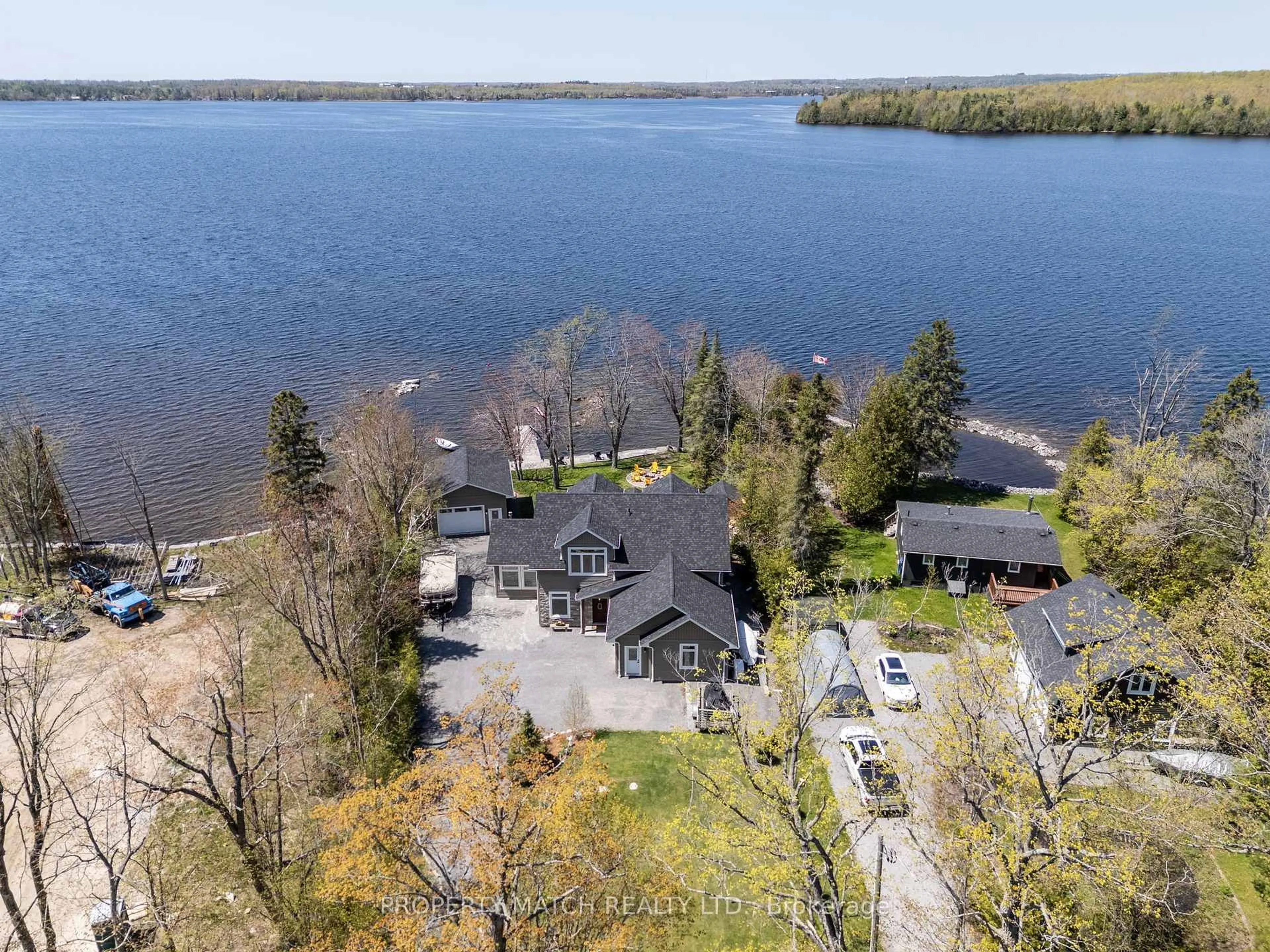 A pic from outside/outdoor area/front of a property/back of a property/a pic from drone, water/lake/river/ocean view for 185 Fire Route 72, Trent Lakes Ontario K0L 1J0