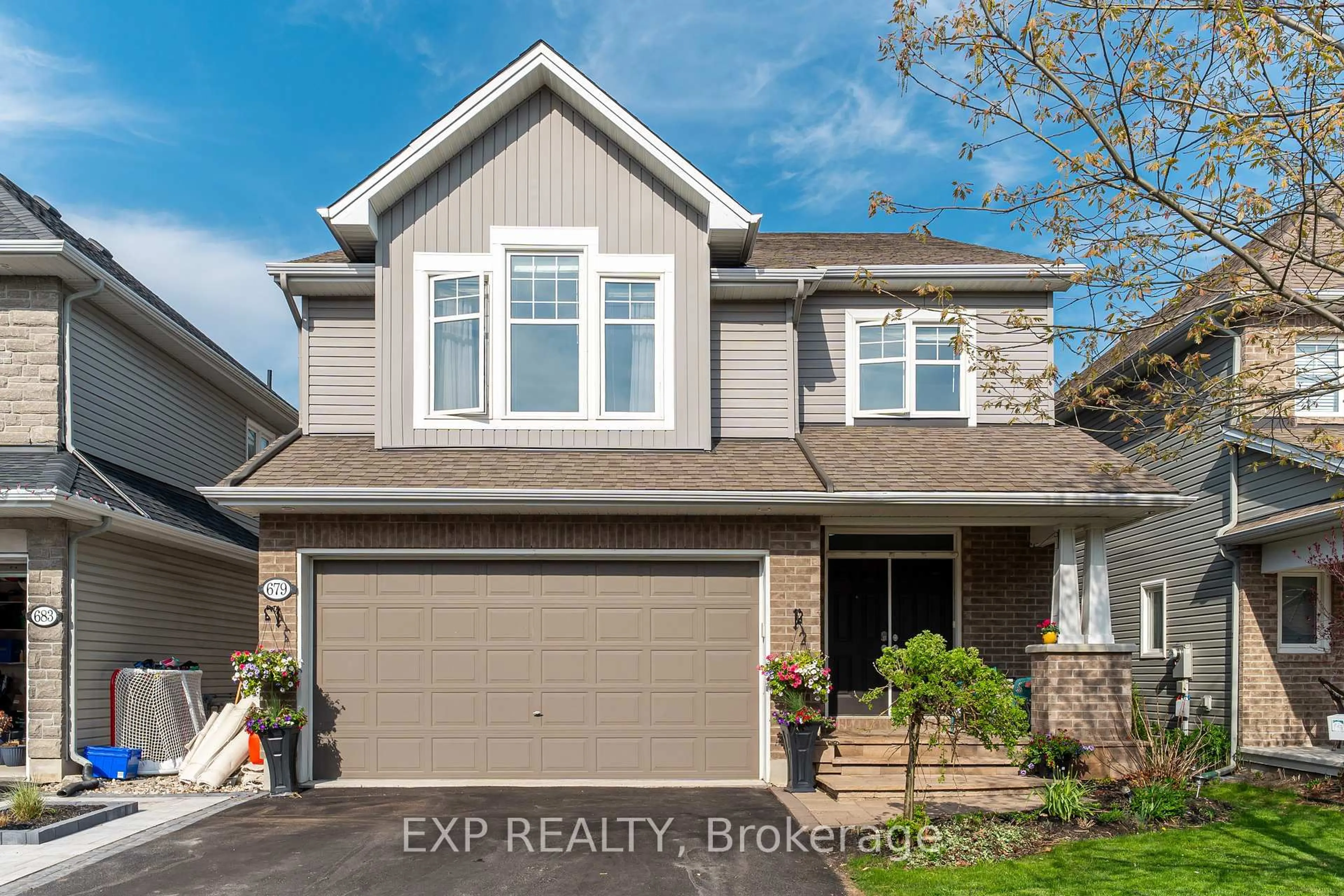 Home with vinyl exterior material, street for 679 Rockrose Way, Ottawa Ontario K1T 0L7