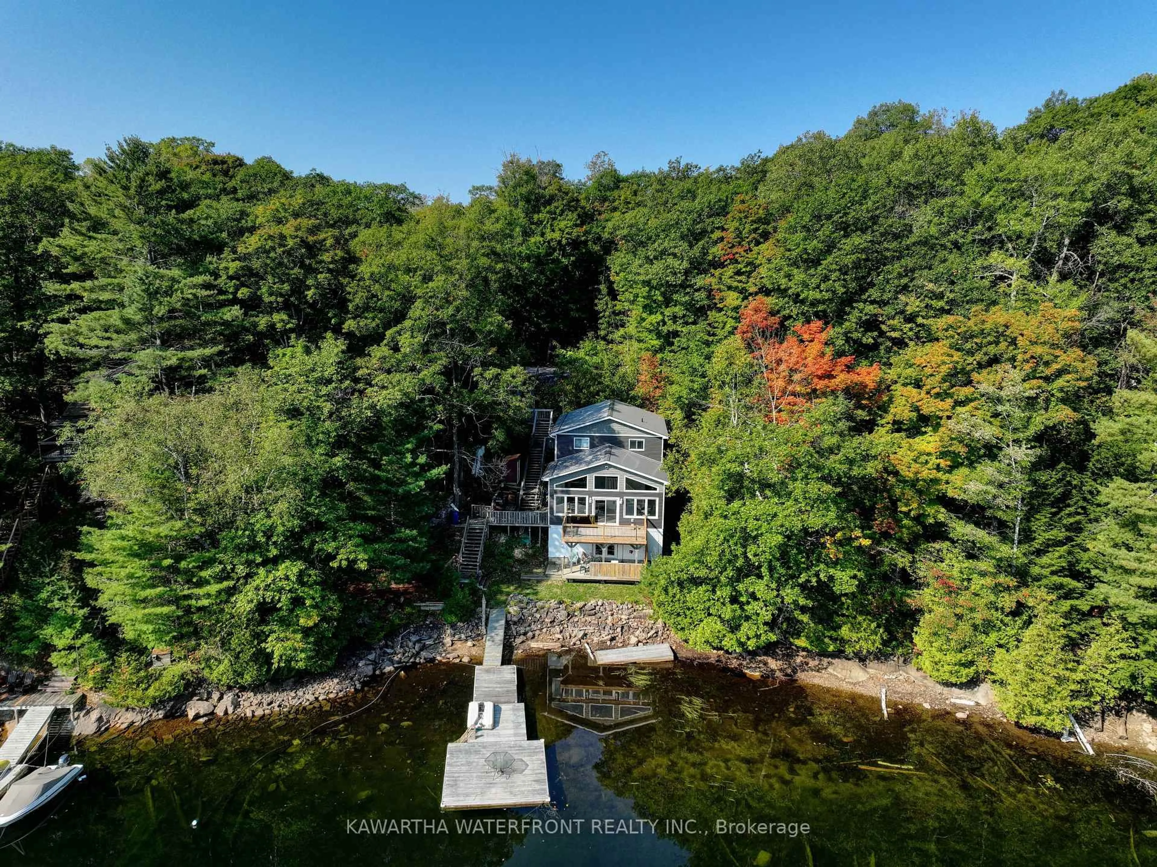 A pic from outside/outdoor area/front of a property/back of a property/a pic from drone, water/lake/river/ocean view for 99 Fire Route 394 Rte, Trent Lakes Ontario K0M 2A0