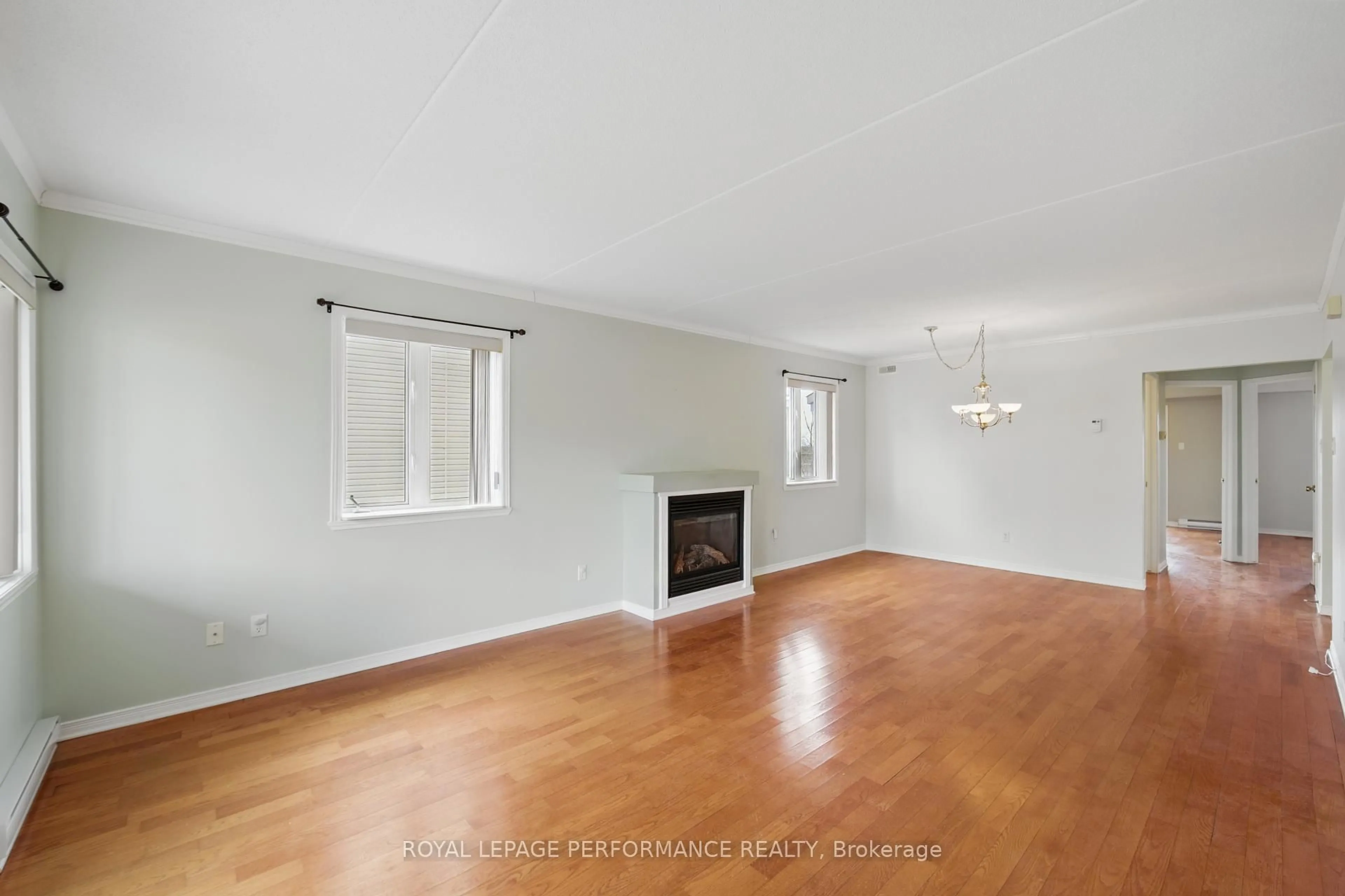 Living room with furniture, wood/laminate floor for 1505 Clement St #308, Hawkesbury Ontario K6A 3V8