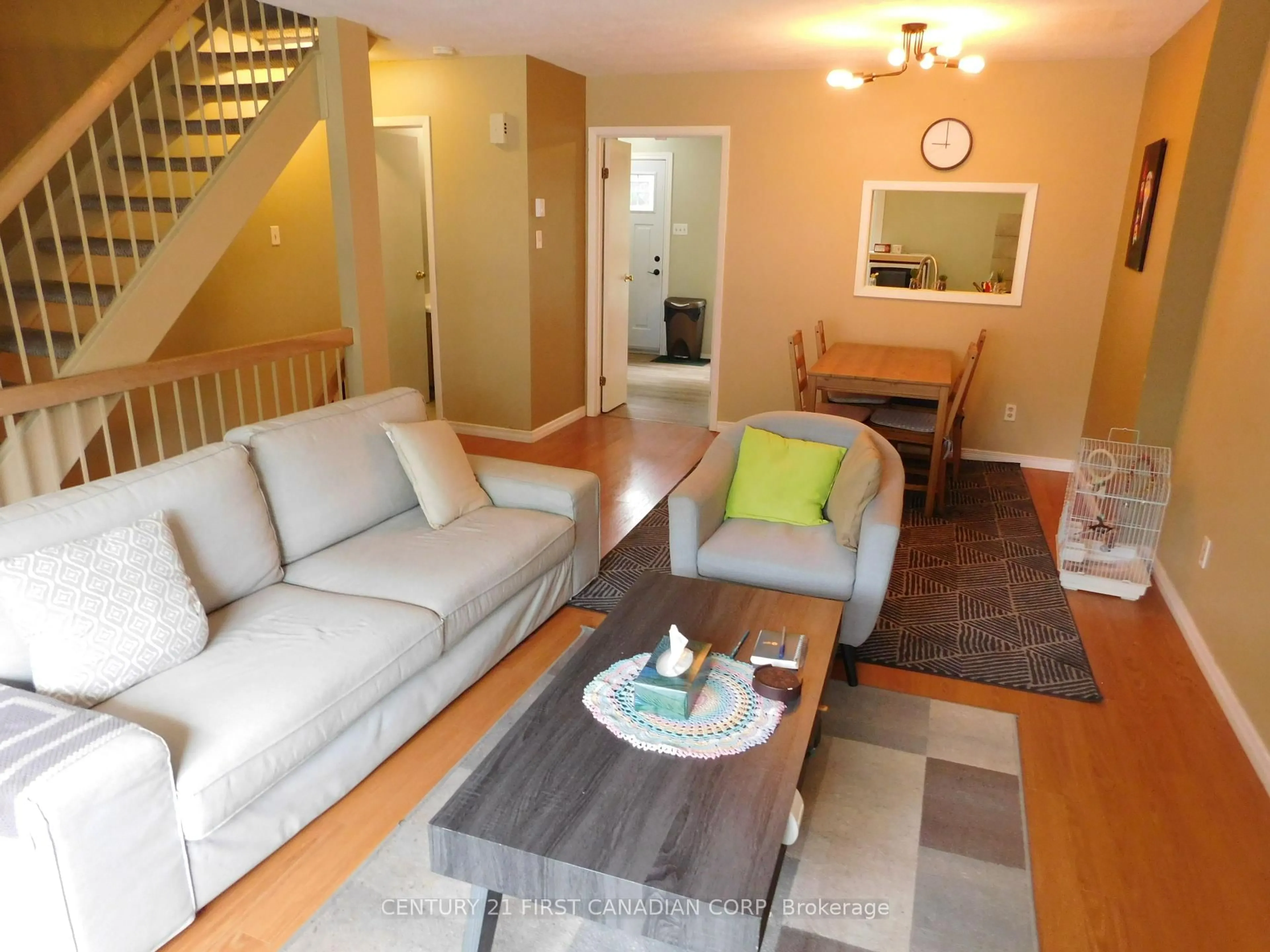 Living room with furniture, wood/laminate floor for 253 Taylor St #22, London East Ontario N5Y 2J6