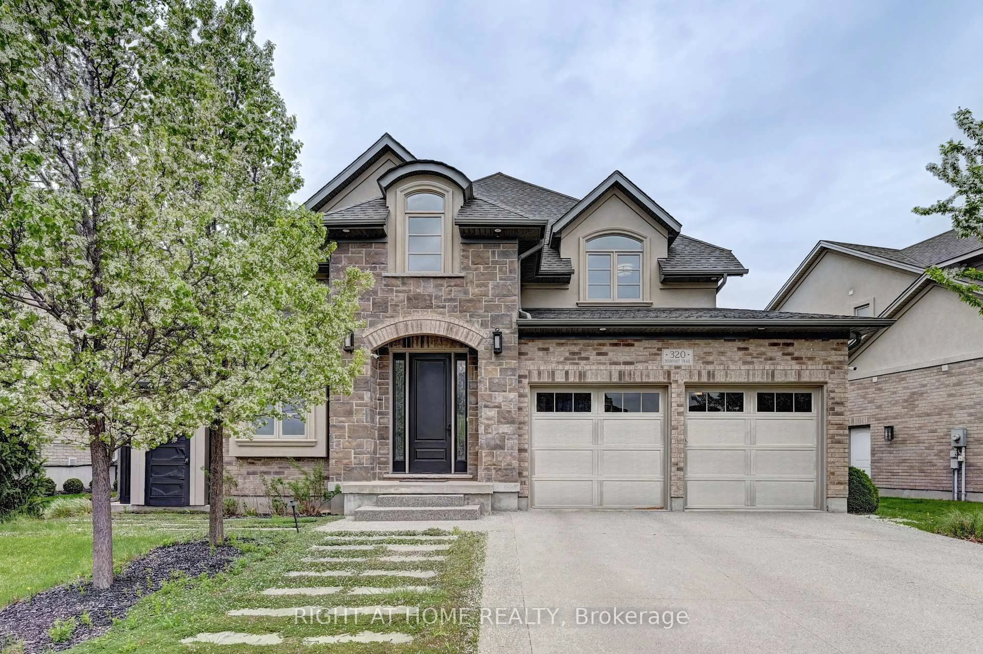 Home with brick exterior material, street for 320 Deerfoot Tr, Waterloo Ontario N2K 0B4