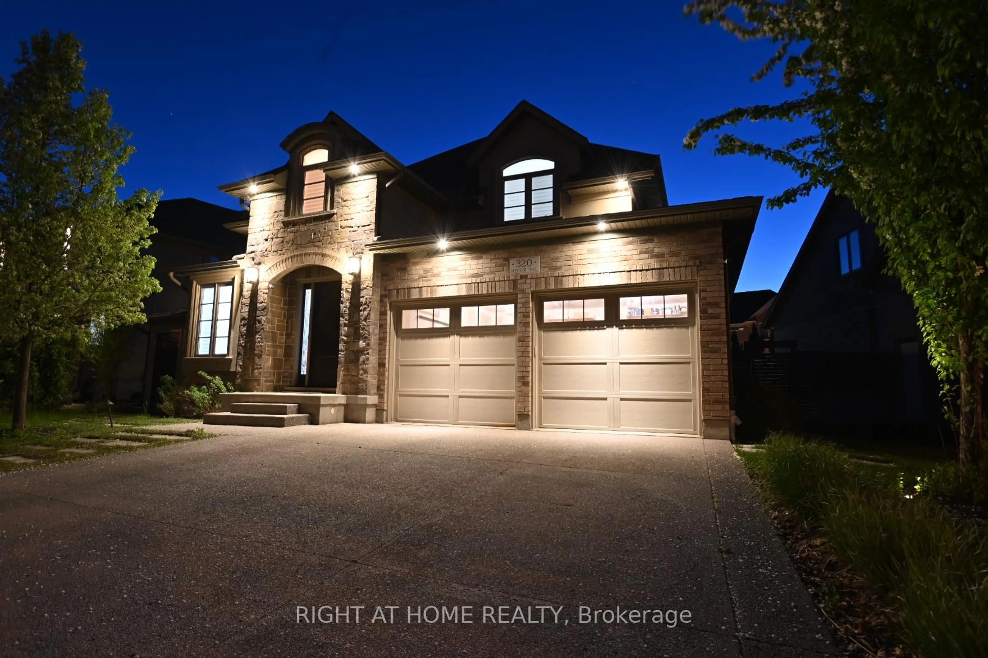 Home with brick exterior material, street for 320 Deerfoot Tr, Waterloo Ontario N2K 0B4