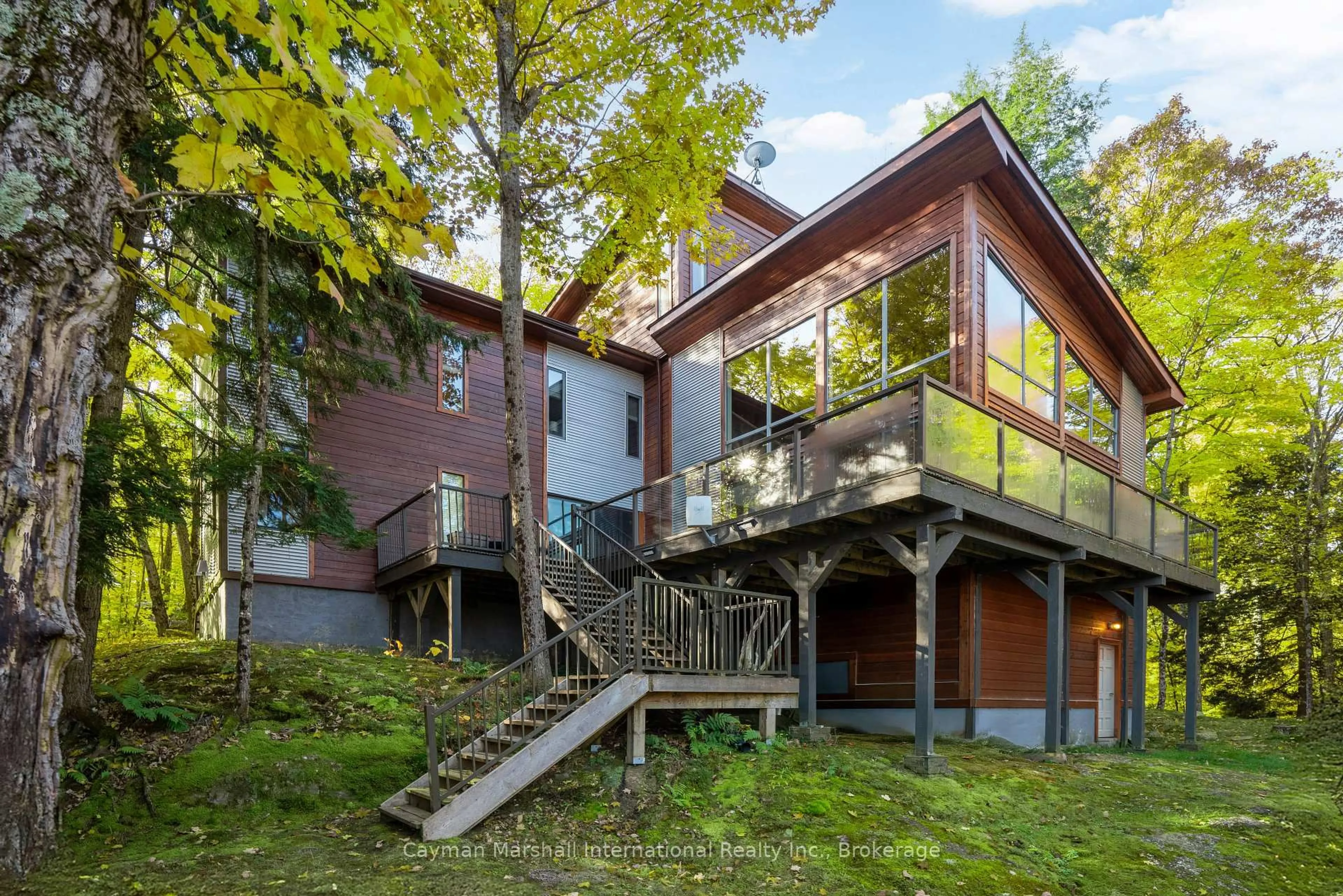 Home with brick exterior material, forest/trees view for 27 Island Tobins R60 Island, Muskoka Lakes Ontario P0B 1J0