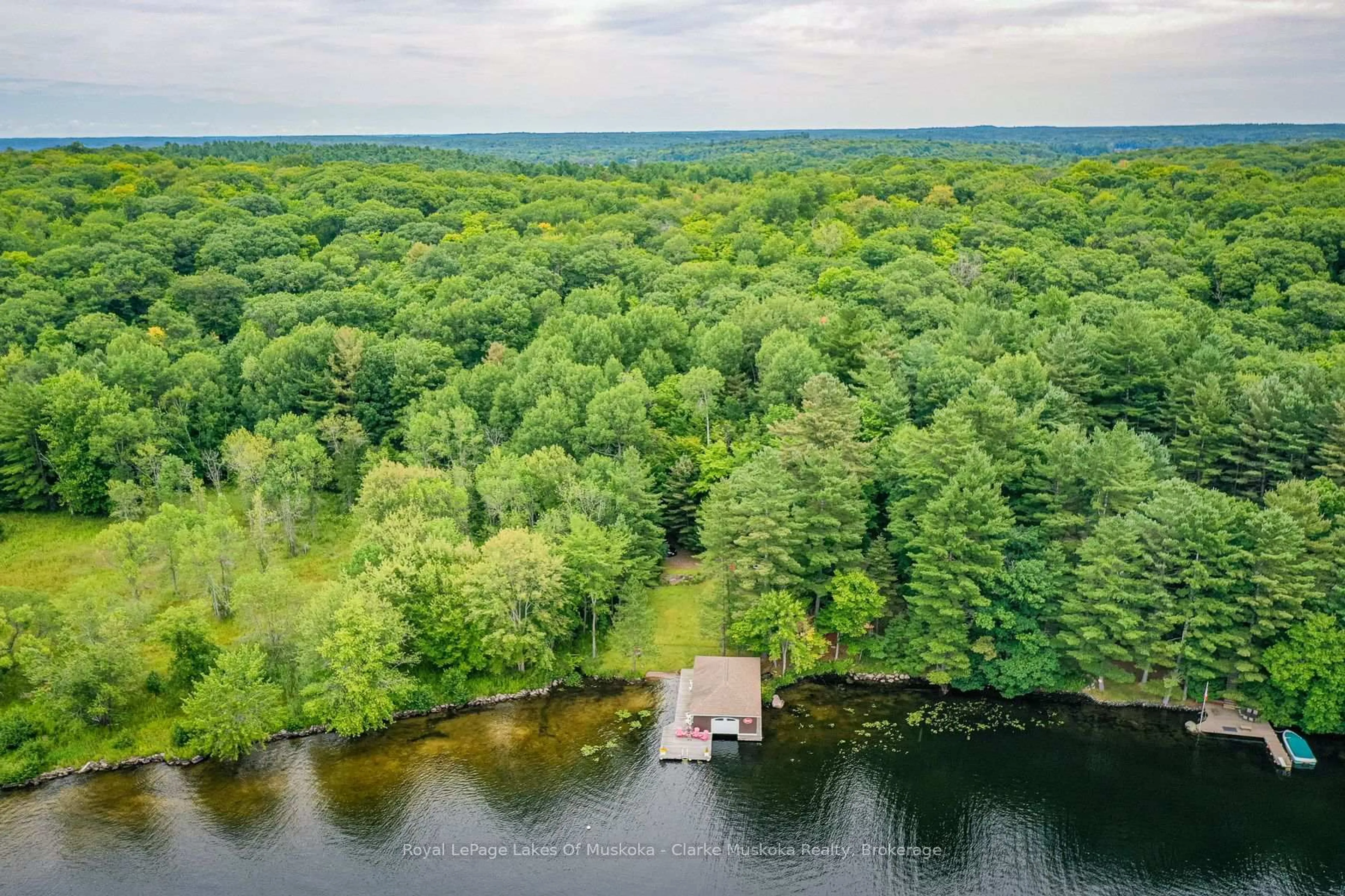 A pic from outside/outdoor area/front of a property/back of a property/a pic from drone, water/lake/river/ocean view for 1007 OMINECA Rd #6, Muskoka Lakes Ontario P0B 1J0