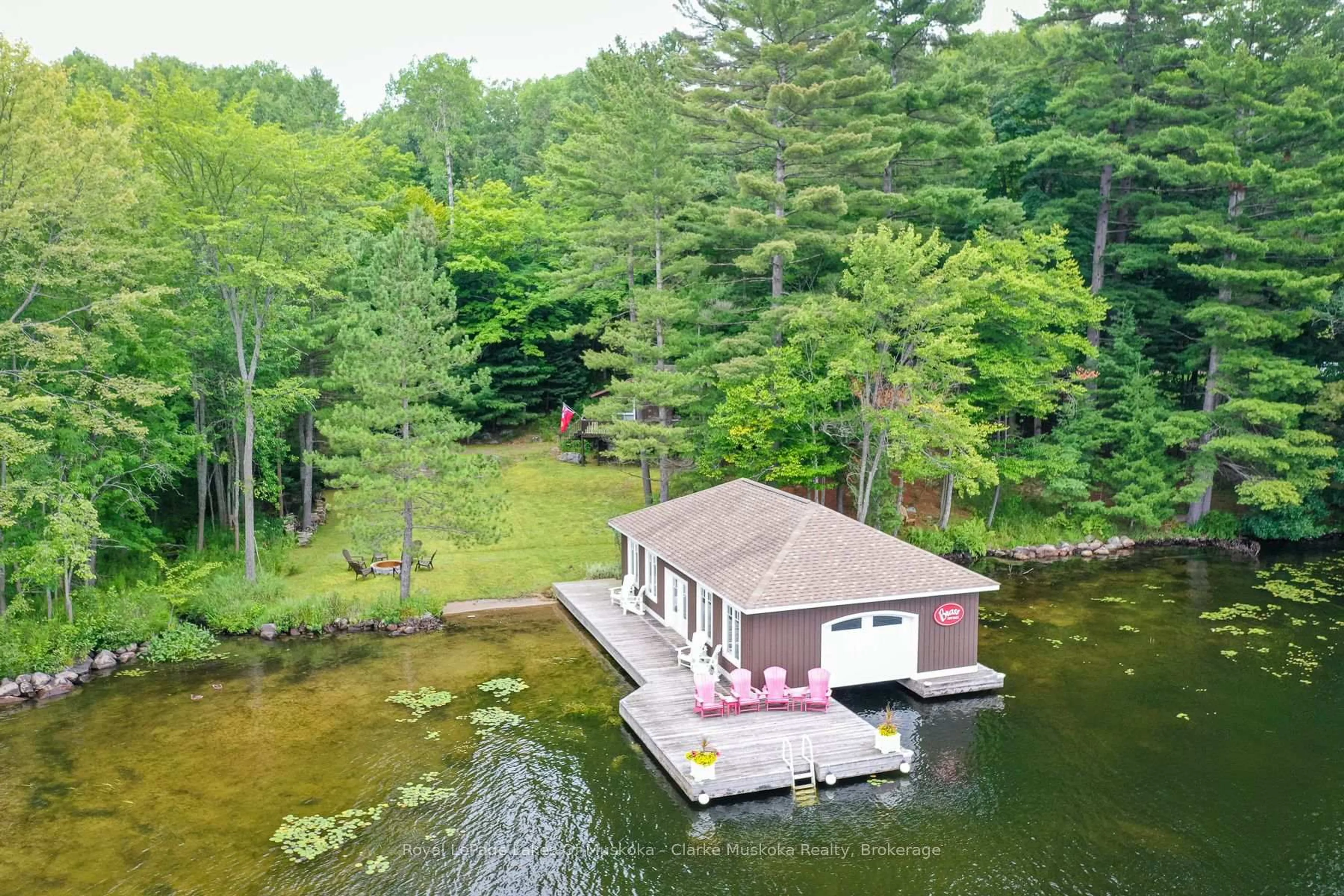 A pic from outside/outdoor area/front of a property/back of a property/a pic from drone, water/lake/river/ocean view for 1007 OMINECA Rd #6, Muskoka Lakes Ontario P0B 1J0