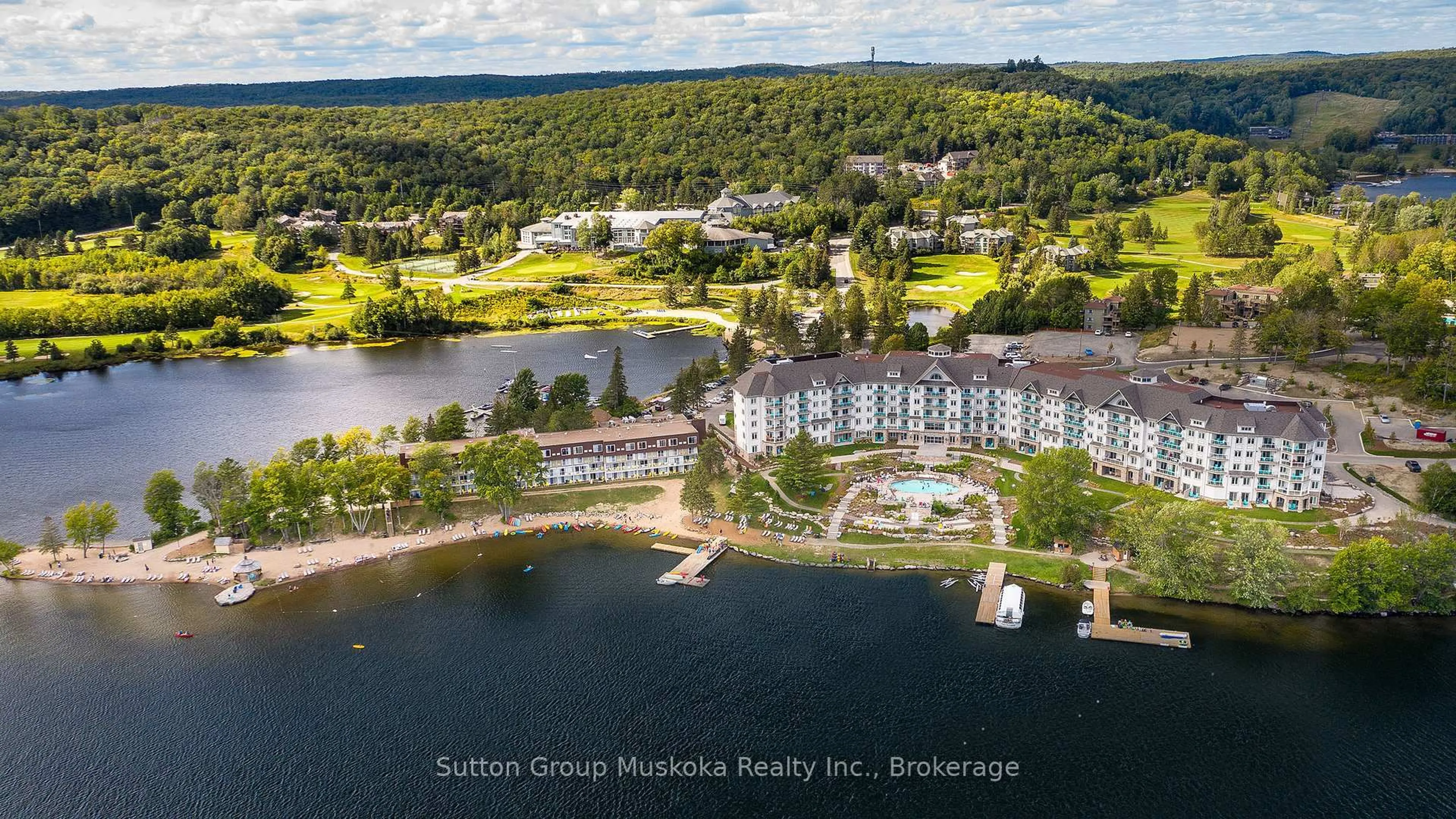 A pic from outside/outdoor area/front of a property/back of a property/a pic from drone, water/lake/river/ocean view for 25 Pen Lake Point Rd #318, Huntsville Ontario P1H 2E8