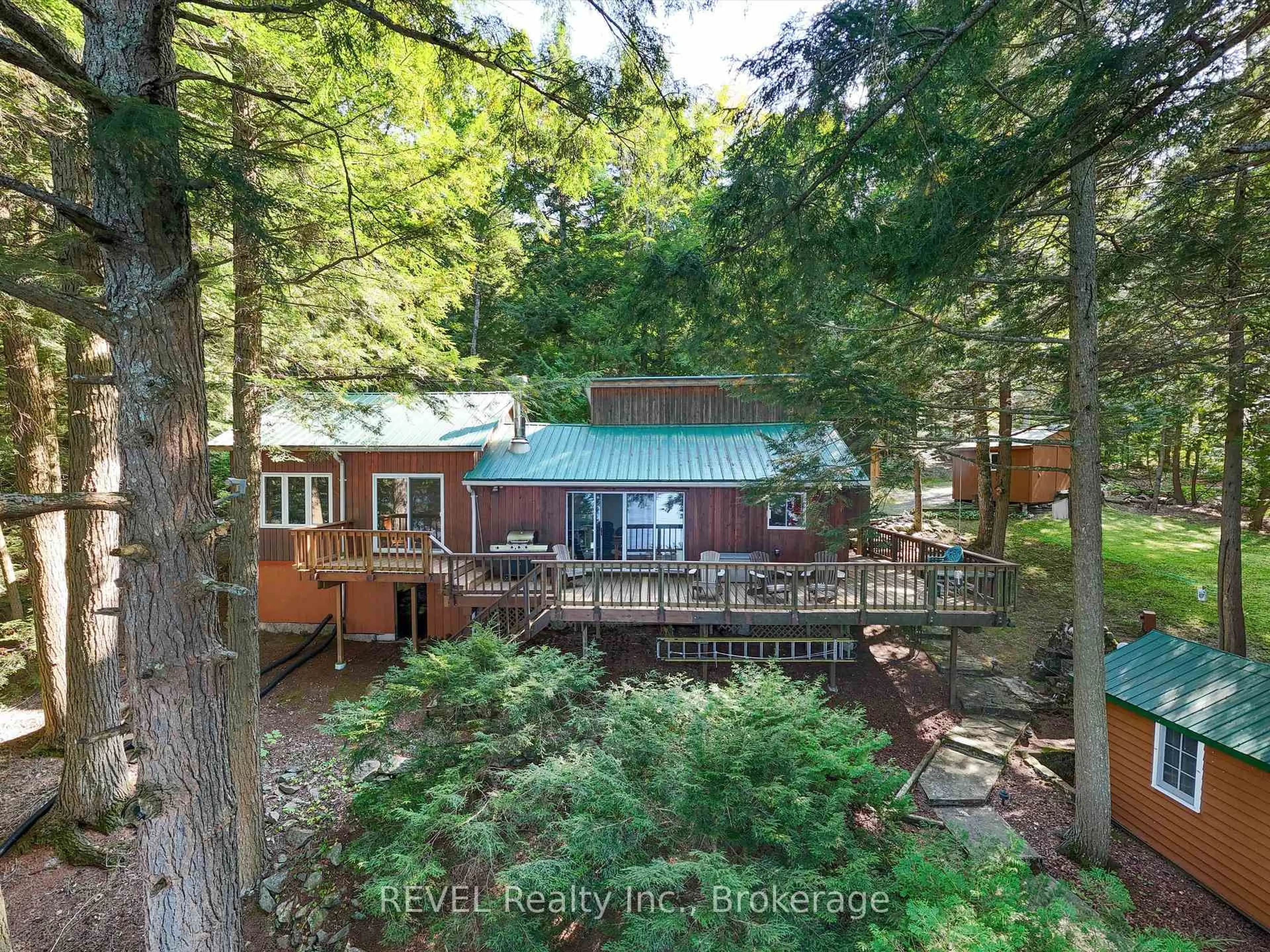 A pic from outside/outdoor area/front of a property/back of a property/a pic from drone, forest/trees view for 1077 Rignalls Rd, Bracebridge Ontario P1L 1X1