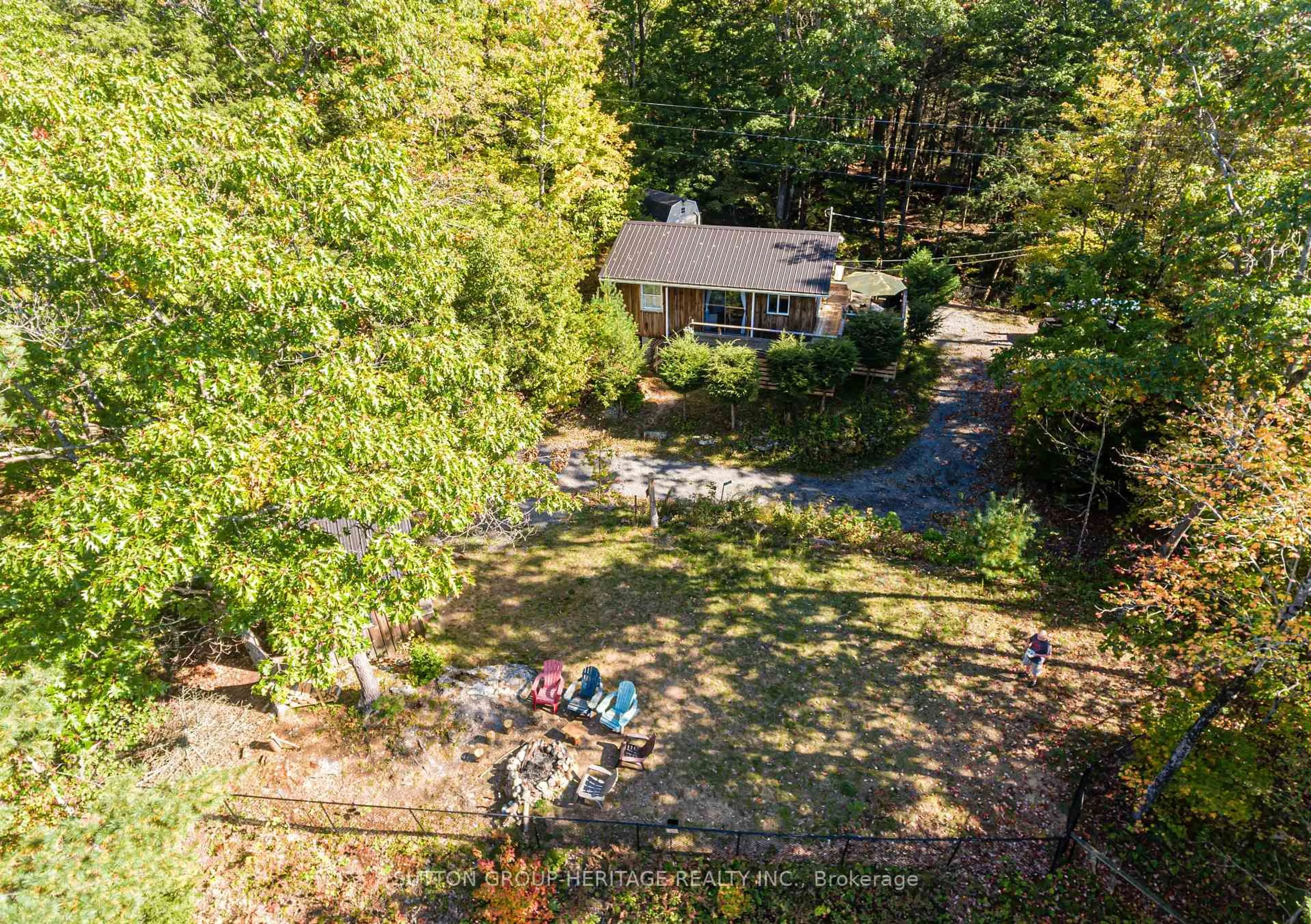 A pic from outside/outdoor area/front of a property/back of a property/a pic from drone, forest/trees view for 250 Younge Lane, Godfrey Ontario K0H 1T0