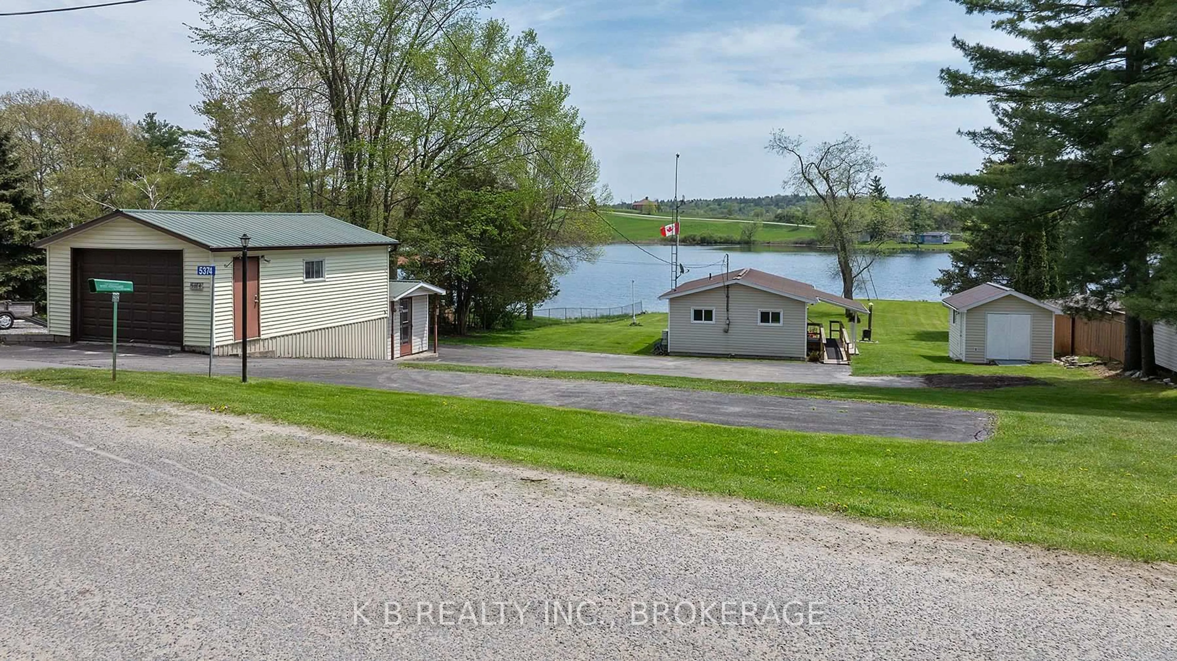 A pic from outside/outdoor area/front of a property/back of a property/a pic from drone, water/lake/river/ocean view for 5374 Rideau Rd, Seeley's Bay Ontario K0H 2N0
