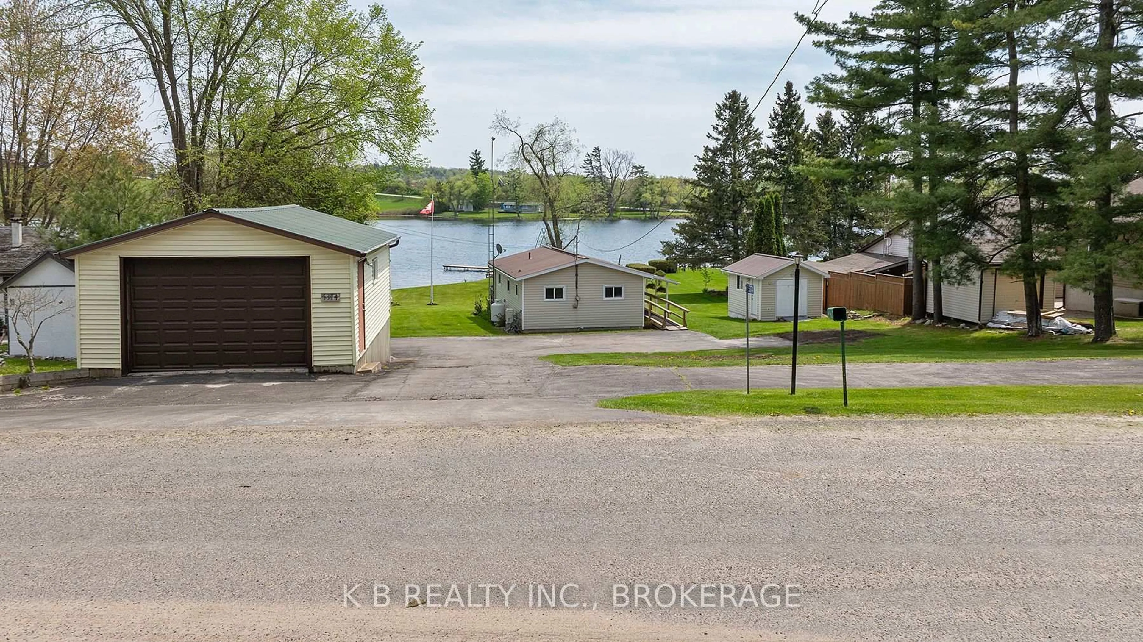 A pic from outside/outdoor area/front of a property/back of a property/a pic from drone, water/lake/river/ocean view for 5374 Rideau Rd, Seeley's Bay Ontario K0H 2N0