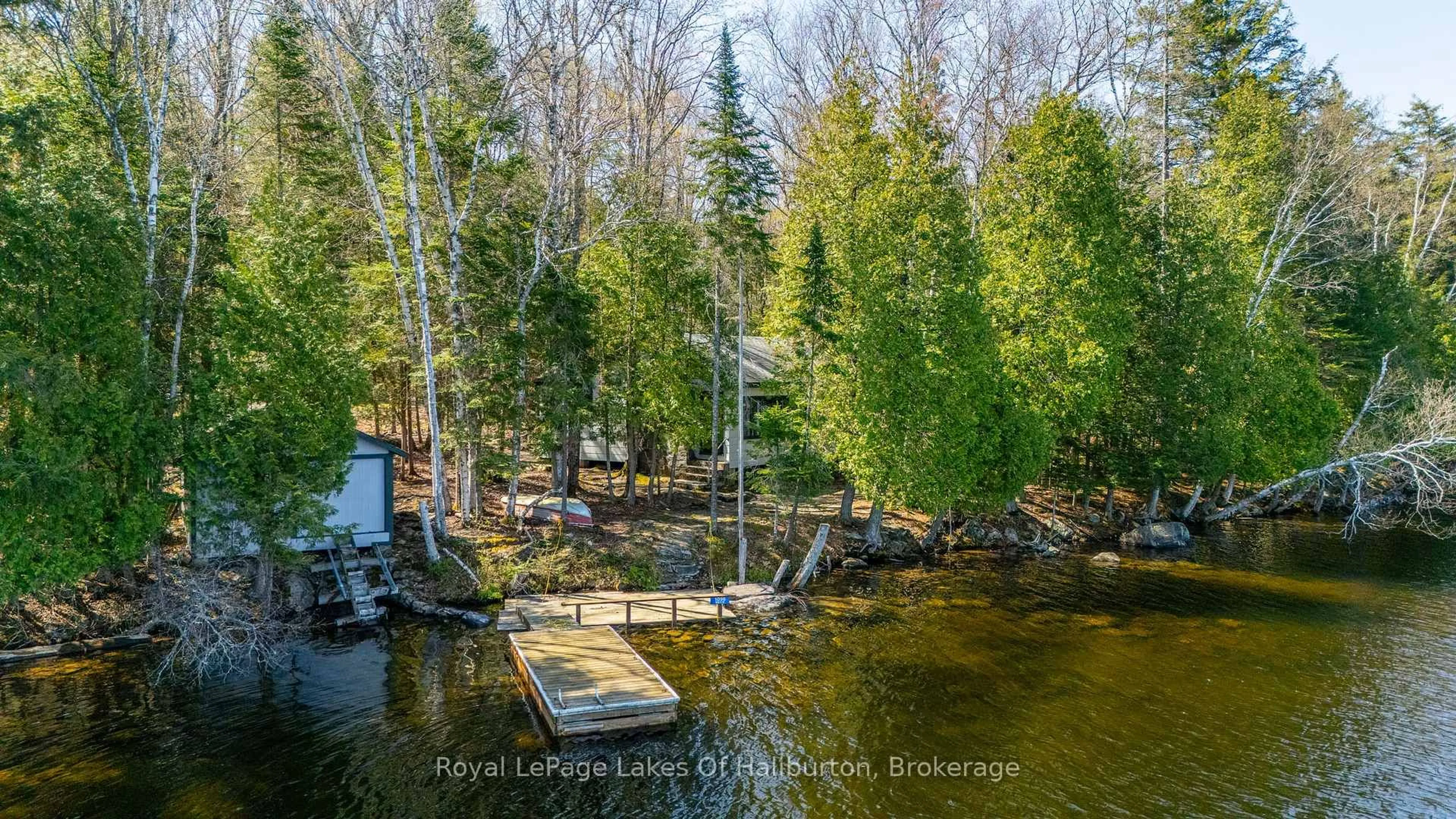 A pic from outside/outdoor area/front of a property/back of a property/a pic from drone, water/lake/river/ocean view for 1096 Reg's Tr, Dysart et al Ontario K0M 1S0