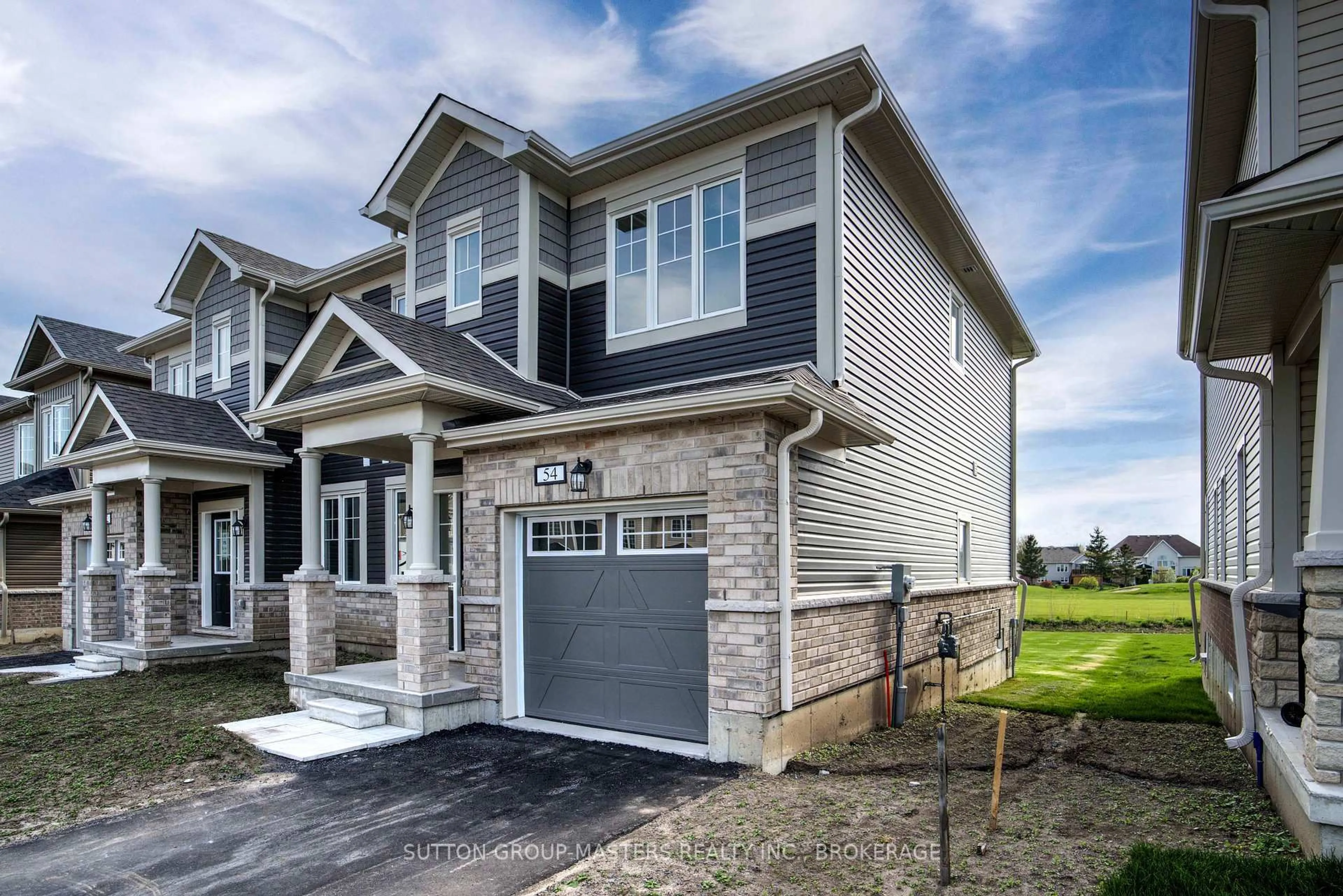 Home with brick exterior material, street for 54 Golf Links Dr, Bath Ontario K0H 1G0