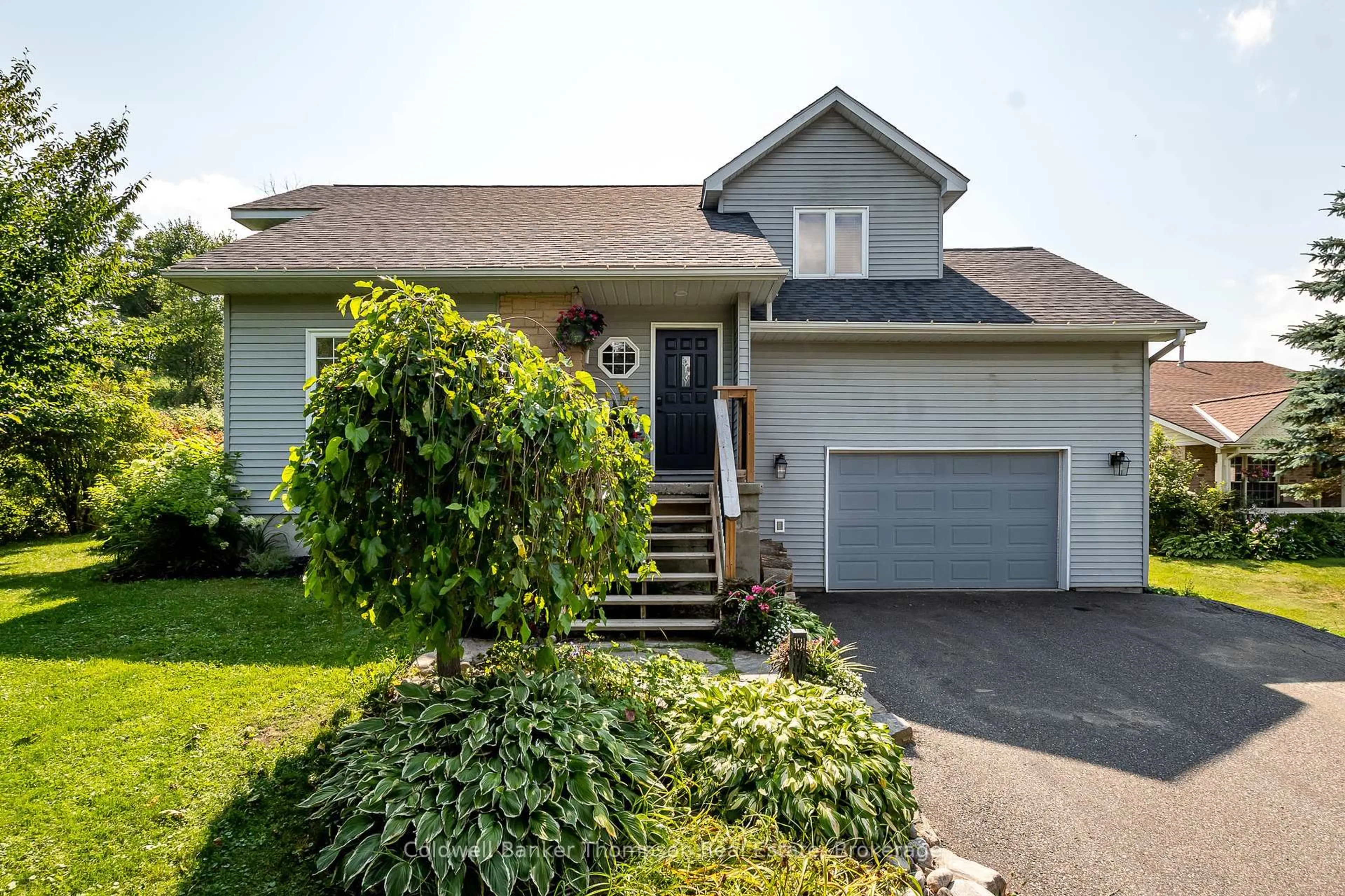 Home with vinyl exterior material, street for 15 COVERED BRIDGE Tr, Bracebridge Ontario P1L 1Y1