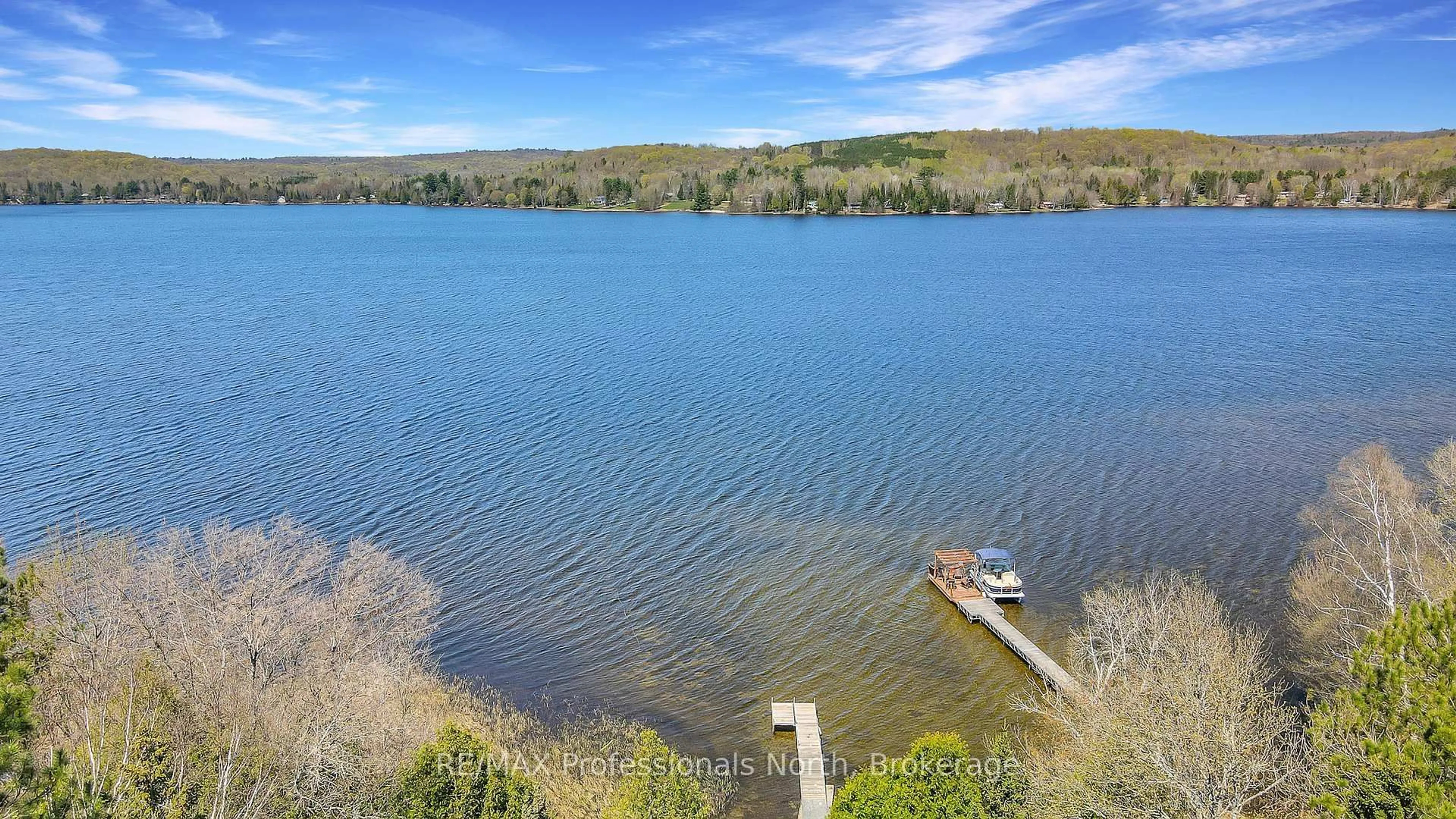 A pic from outside/outdoor area/front of a property/back of a property/a pic from drone, water/lake/river/ocean view for 1130 Fader Dr, Algonquin Highlands Ontario K0M 1S0