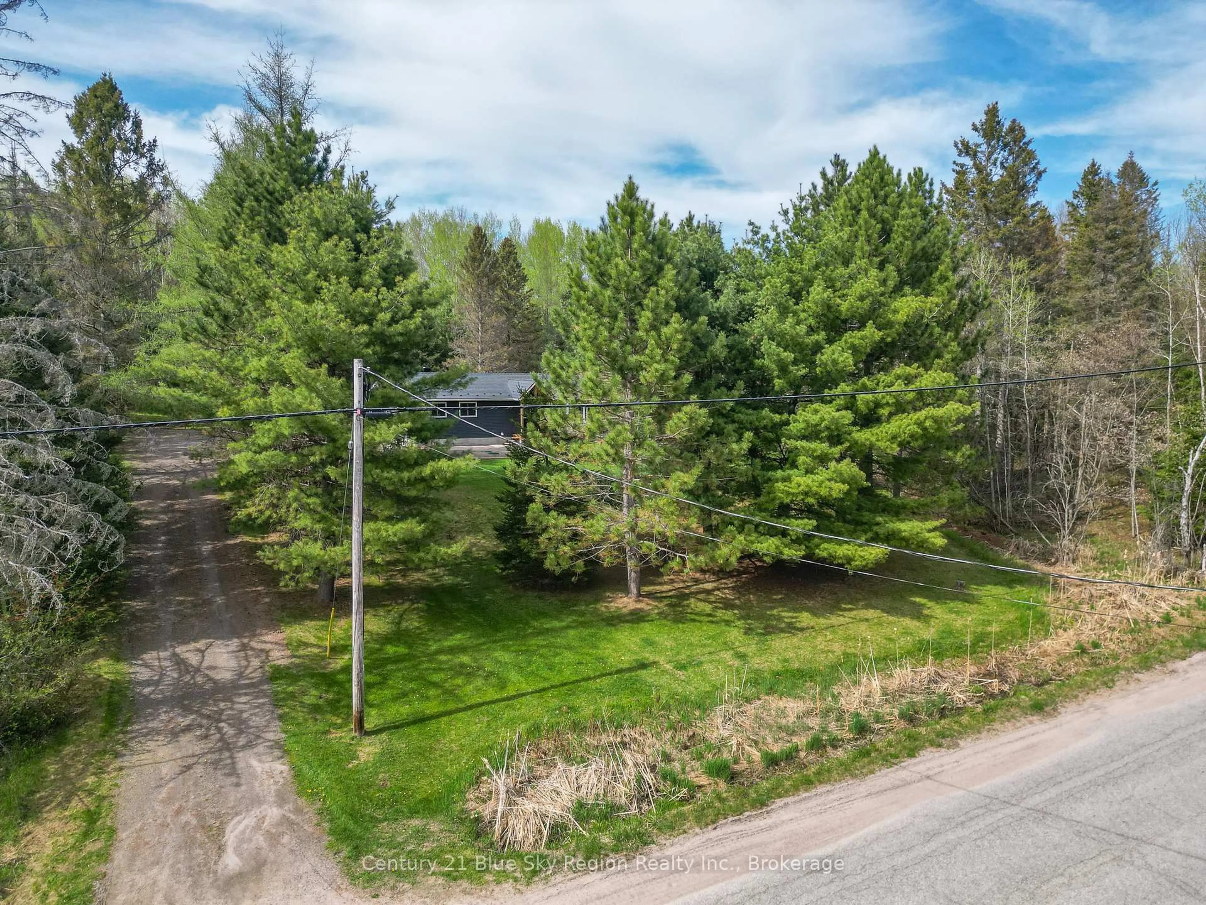A pic from outside/outdoor area/front of a property/back of a property/a pic from drone, forest/trees view for 133 South Shore Rd, East Ferris Ontario P0H 1B0