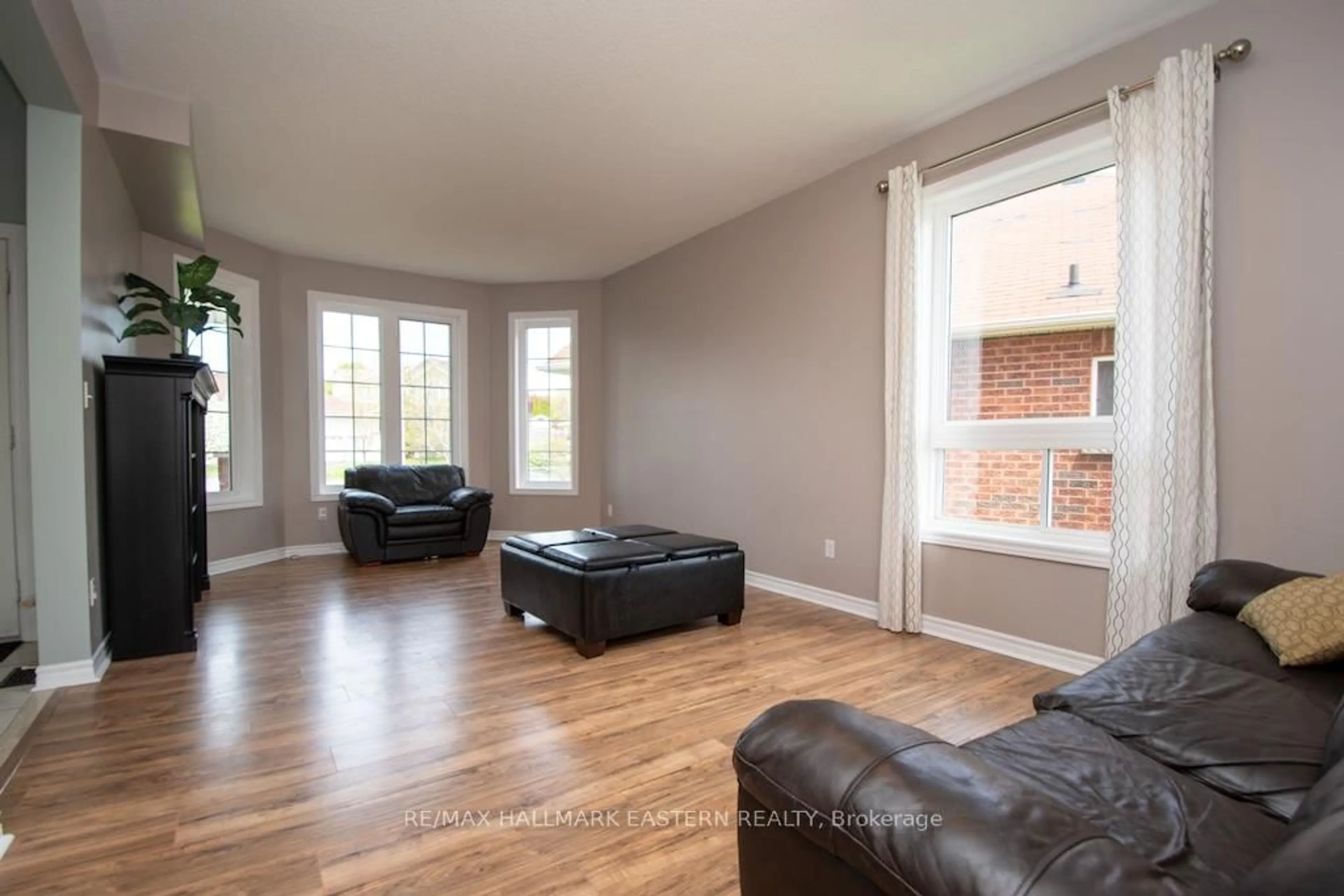 Living room with furniture, wood/laminate floor for 962 Baker St, Peterborough North Ontario K9H 7P7