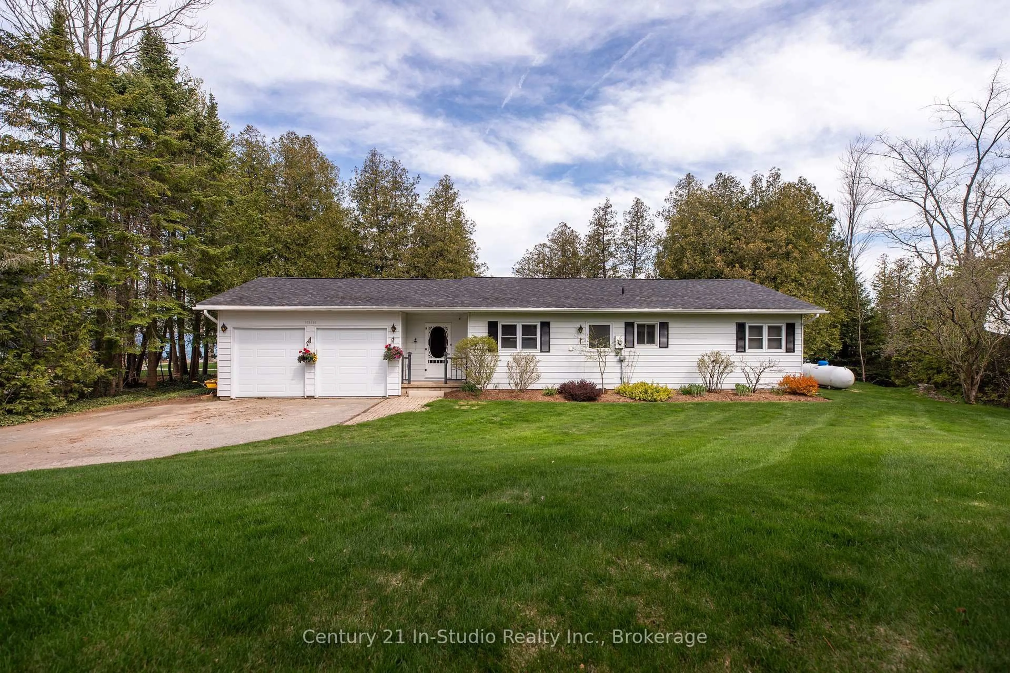 A pic from outside/outdoor area/front of a property/back of a property/a pic from drone, street for 502325 Grey Road 1 Rd, Georgian Bluffs Ontario N0H 2T0