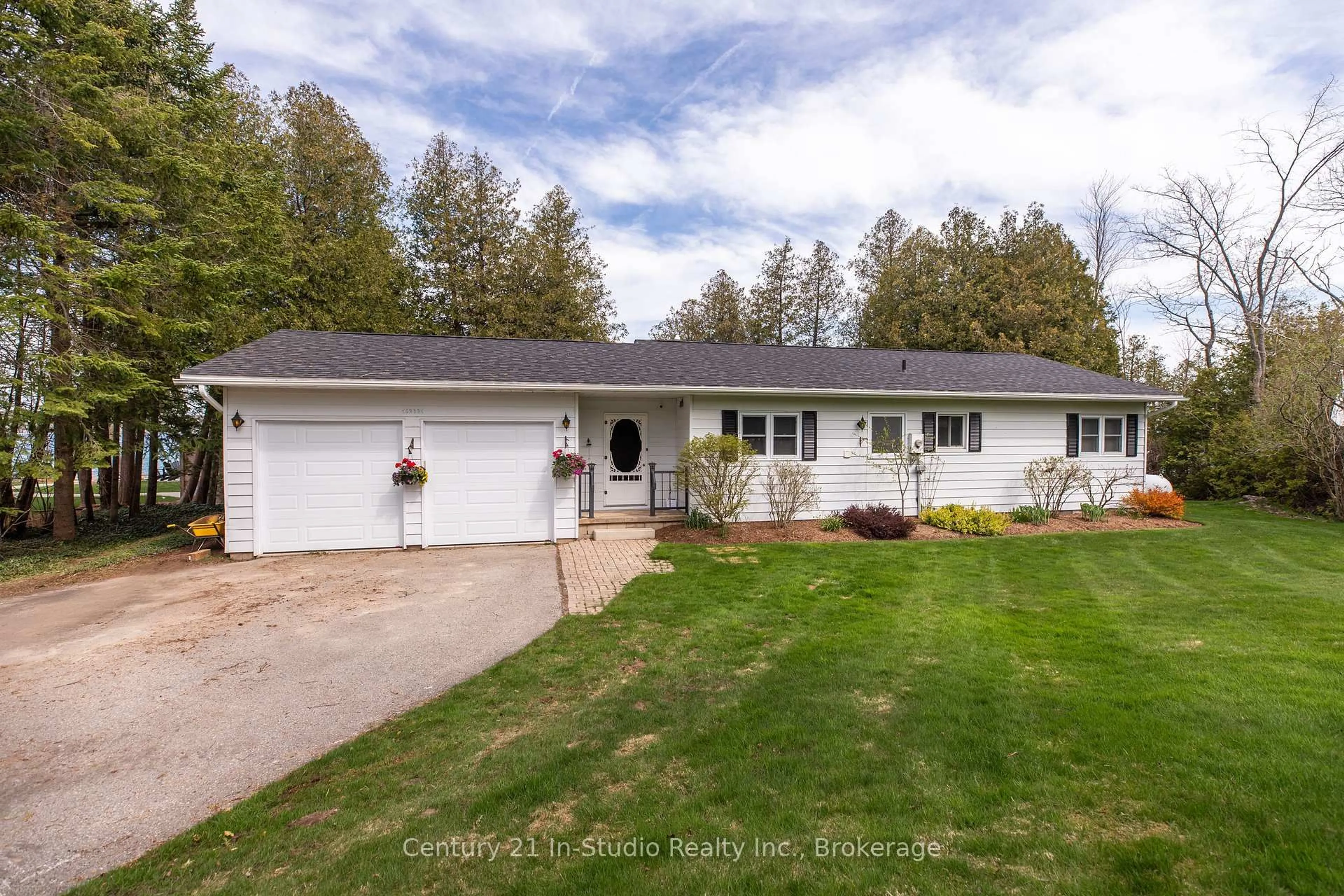 A pic from outside/outdoor area/front of a property/back of a property/a pic from drone, street for 502325 Grey Road 1 Rd, Georgian Bluffs Ontario N0H 2T0