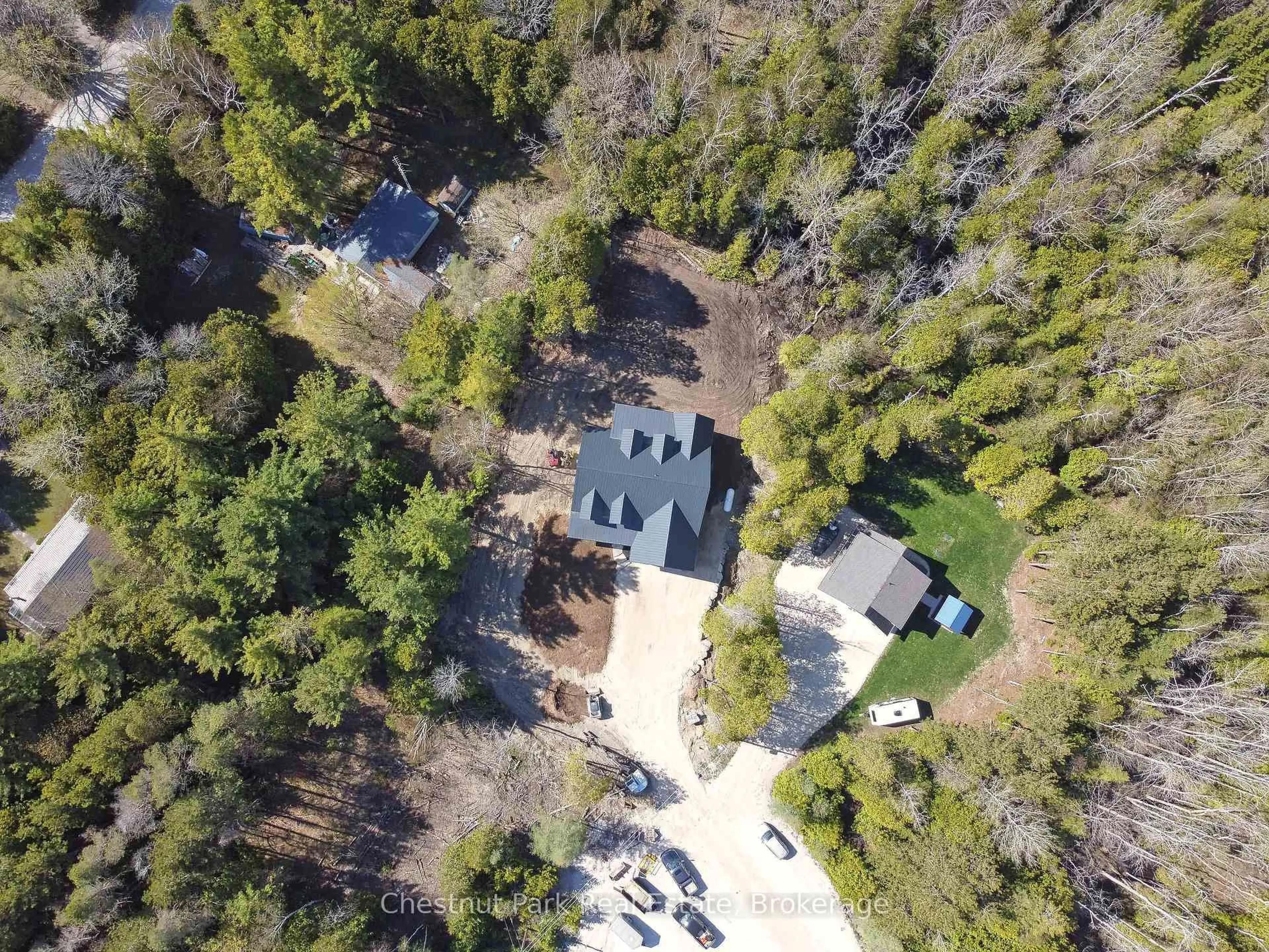 A pic from outside/outdoor area/front of a property/back of a property/a pic from drone, forest/trees view for 24 Phillips Pl, South Bruce Peninsula Ontario N0H 2T0
