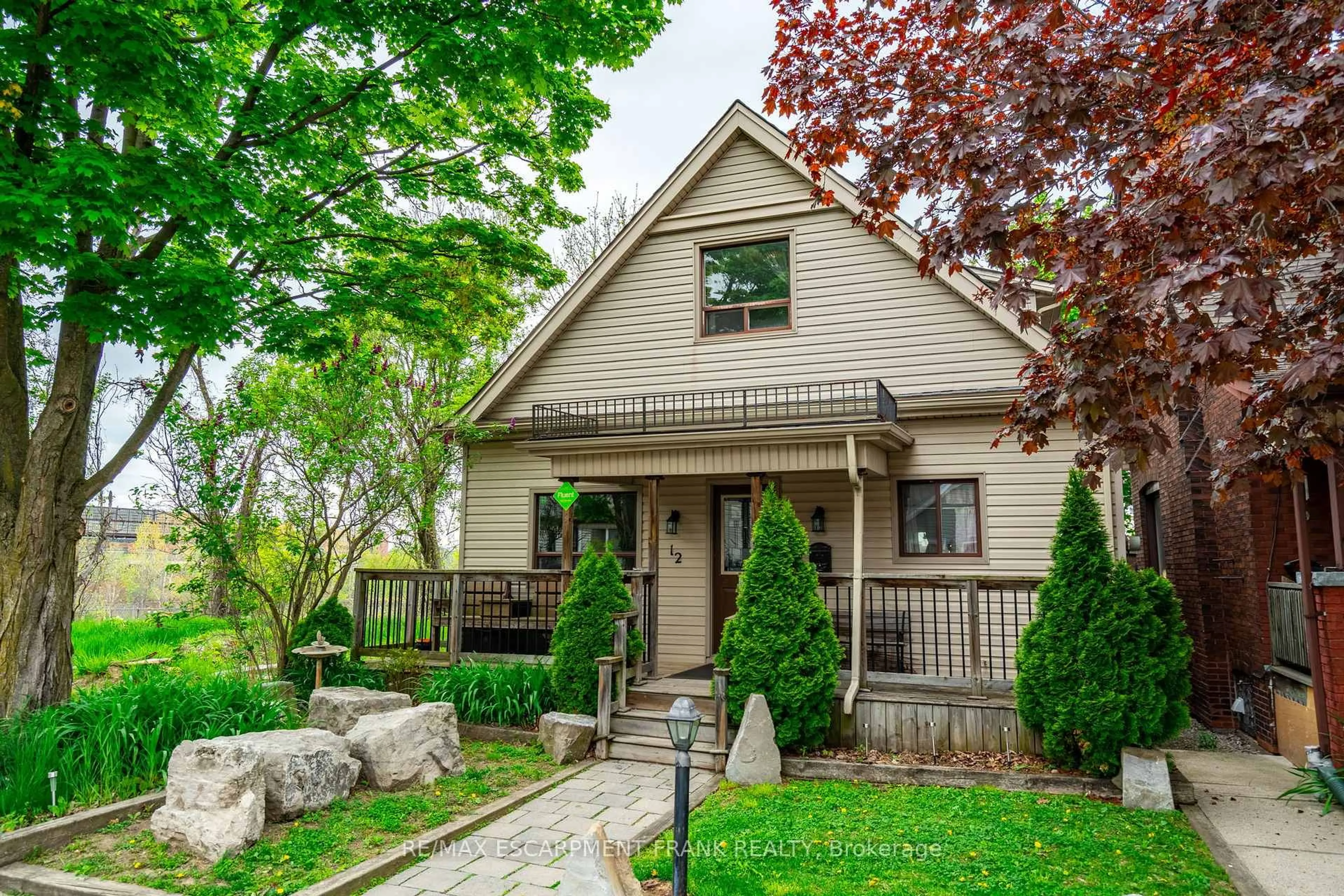 Home with vinyl exterior material, street for 12 Rossmore Ave, Hamilton Ontario L8P 2N3