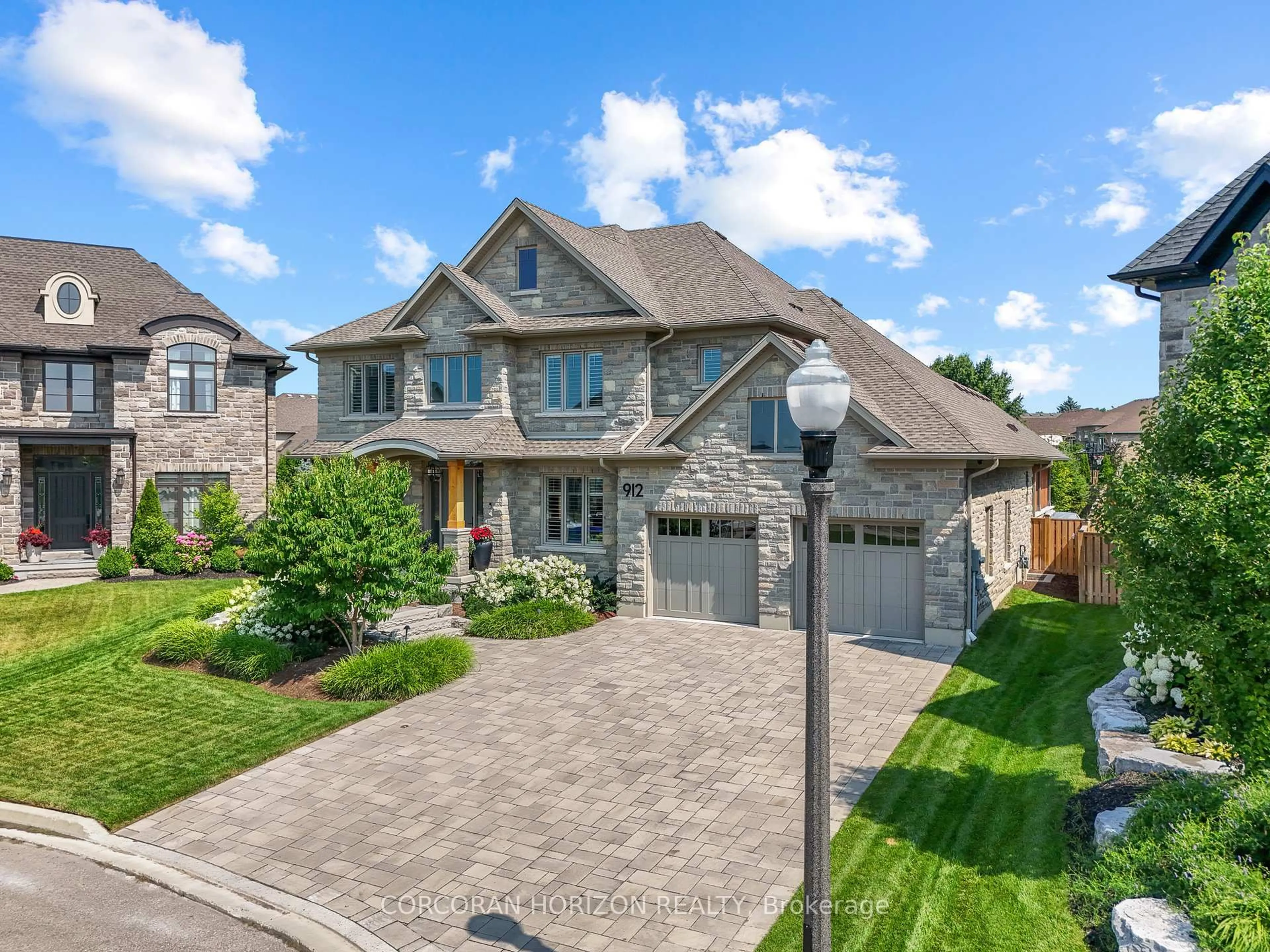 Home with brick exterior material, street for 912 Fall Harvest Crt, Kitchener Ontario N2P 0G6