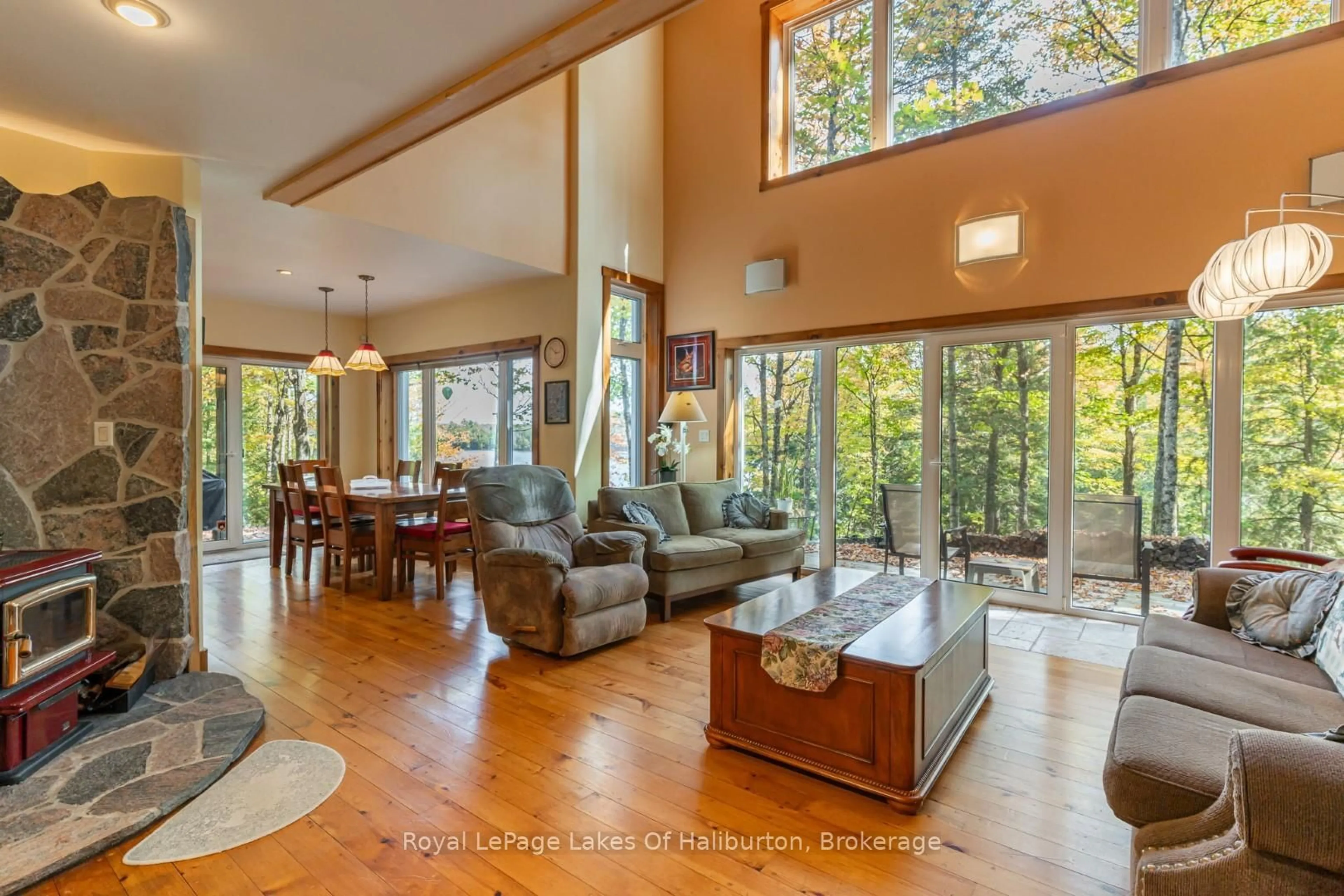 Living room with furniture, wood/laminate floor for 48 Russell Dr, Trent Lakes Ontario K0M 2A0