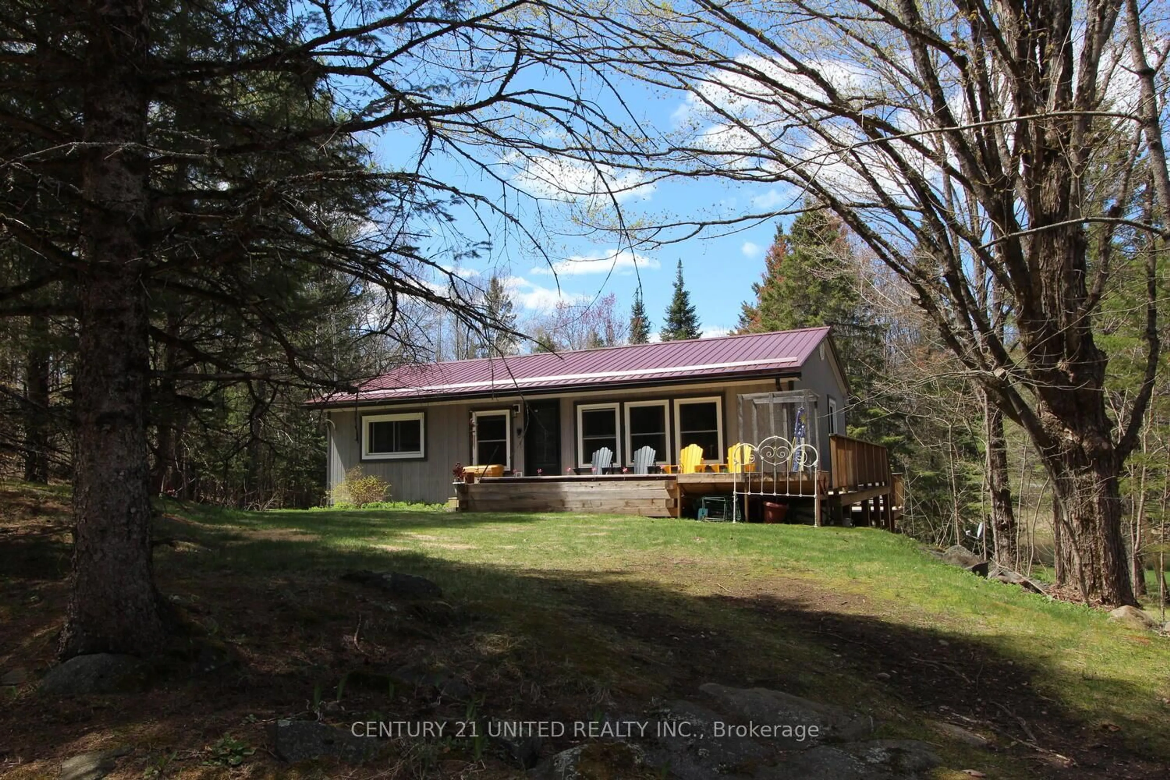A pic from outside/outdoor area/front of a property/back of a property/a pic from drone, unknown for 1001 English Circ, Highlands East Ontario K0M 1R0