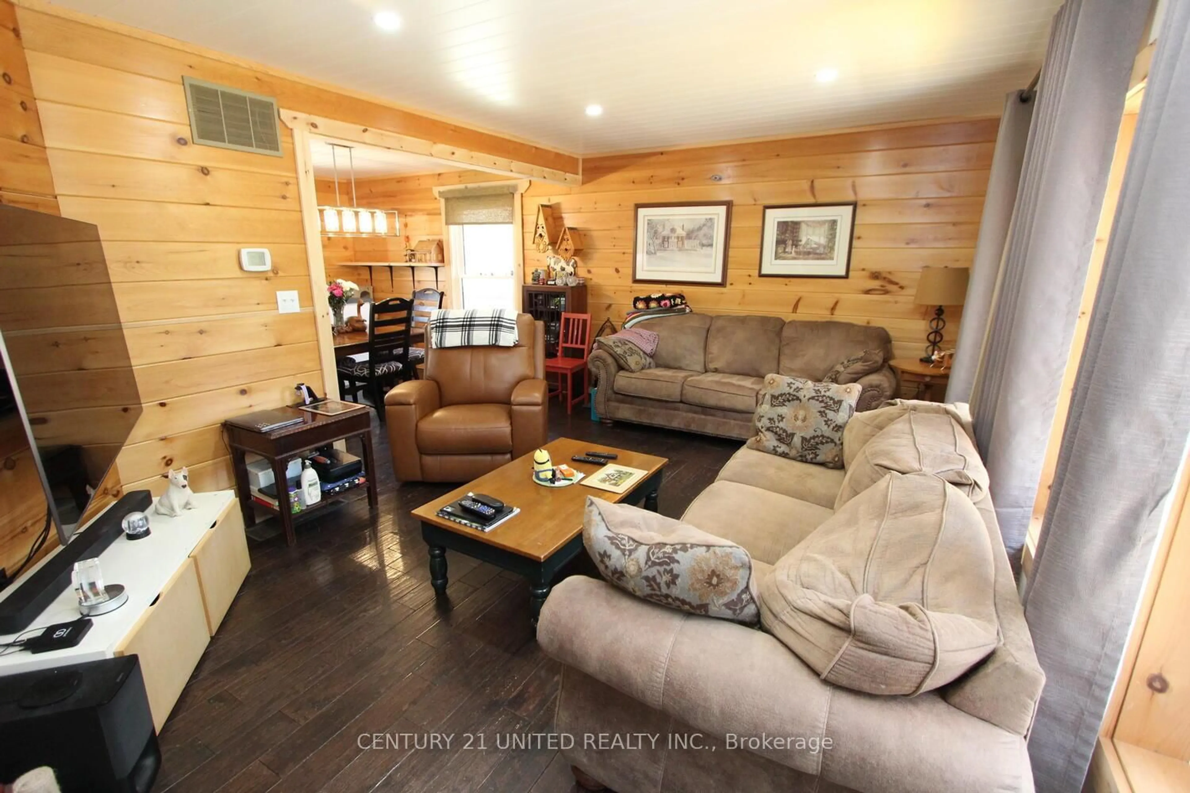 Living room with furniture, wood/laminate floor for 1001 English Circ, Highlands East Ontario K0M 1R0