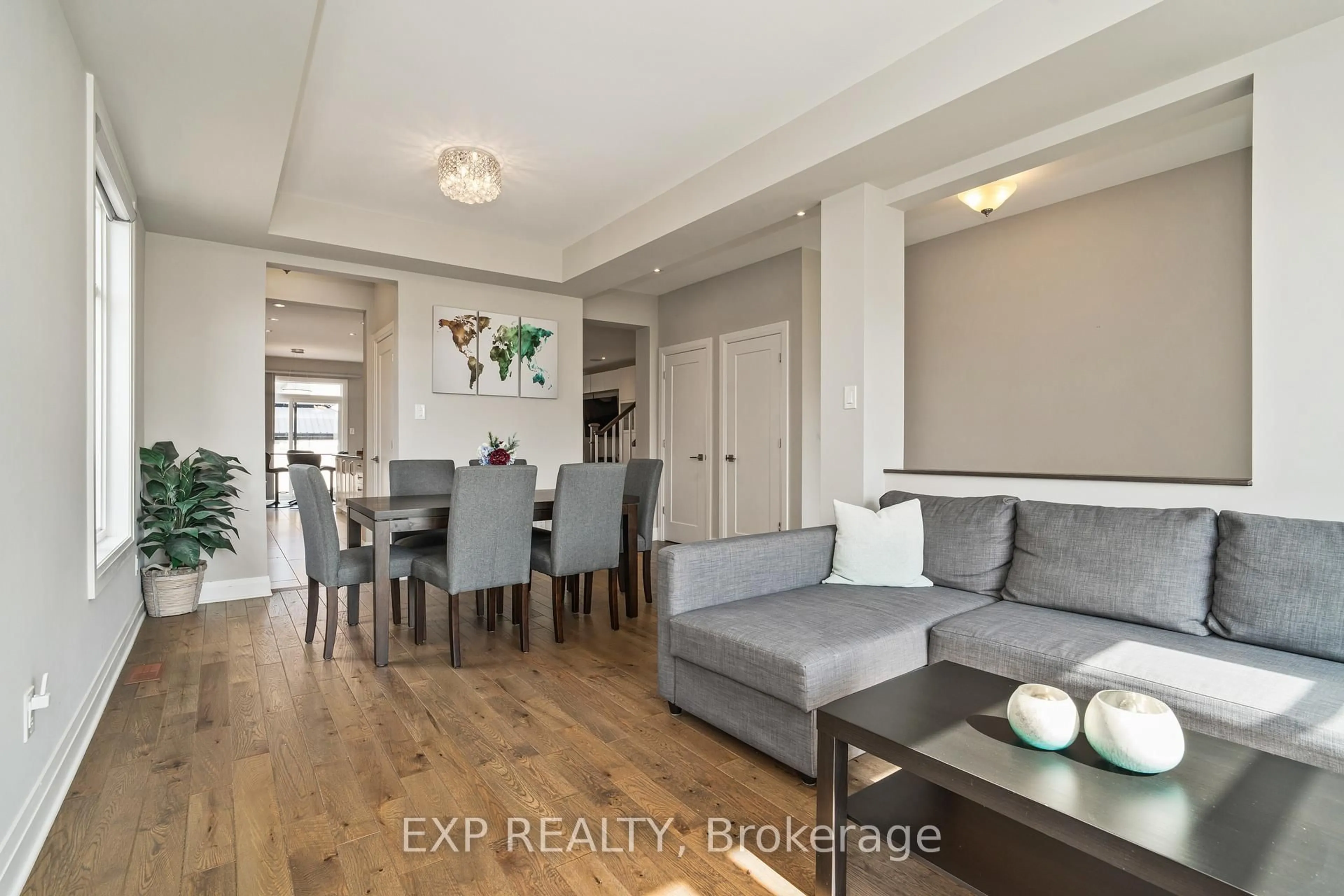 Living room with furniture, wood/laminate floor for 301 SERENADE Cres, Ottawa Ontario K1X 0B9