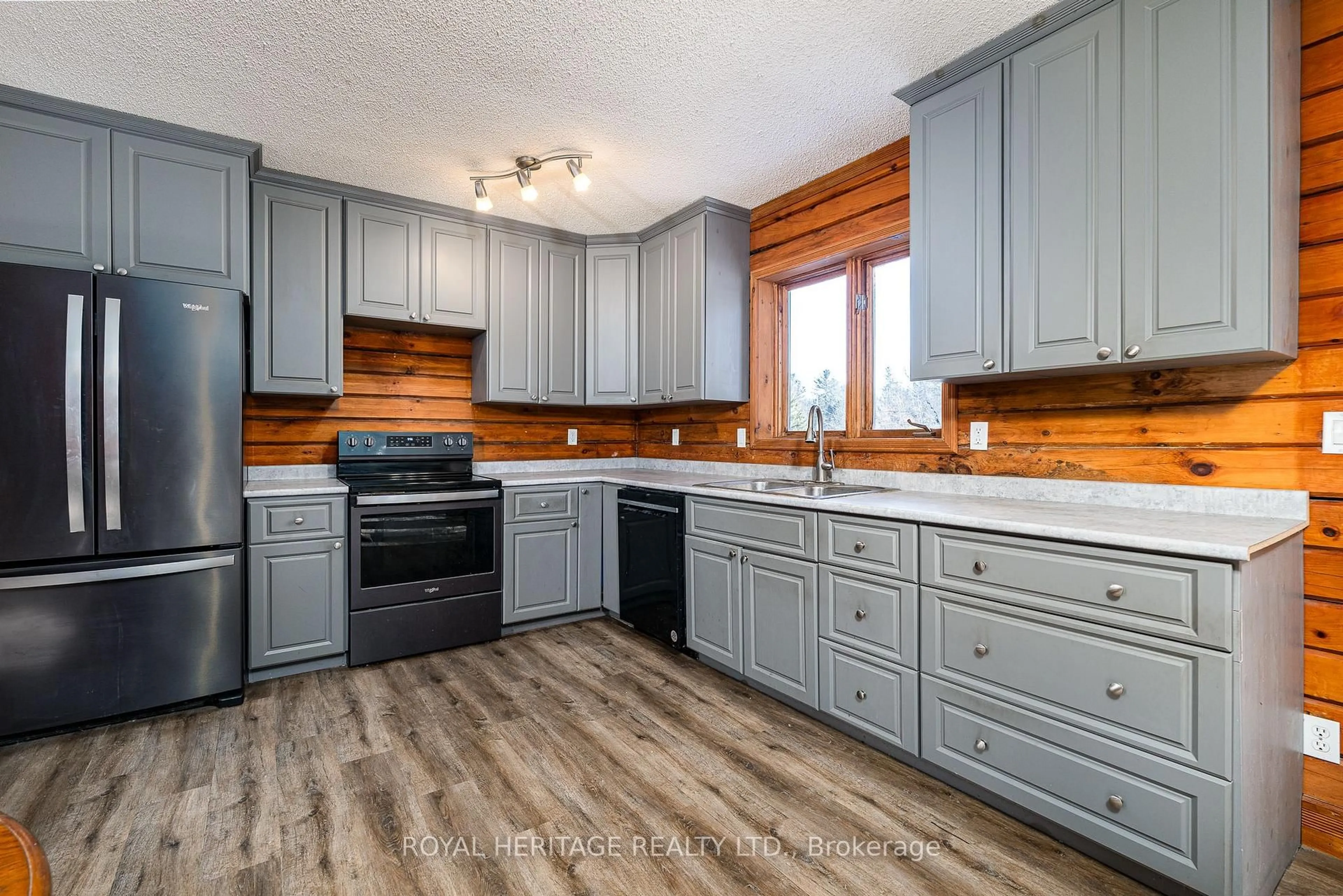 Open concept kitchen, wood/laminate floor for 19 Mccrea Crt, Tweed Ontario K0K 3J0