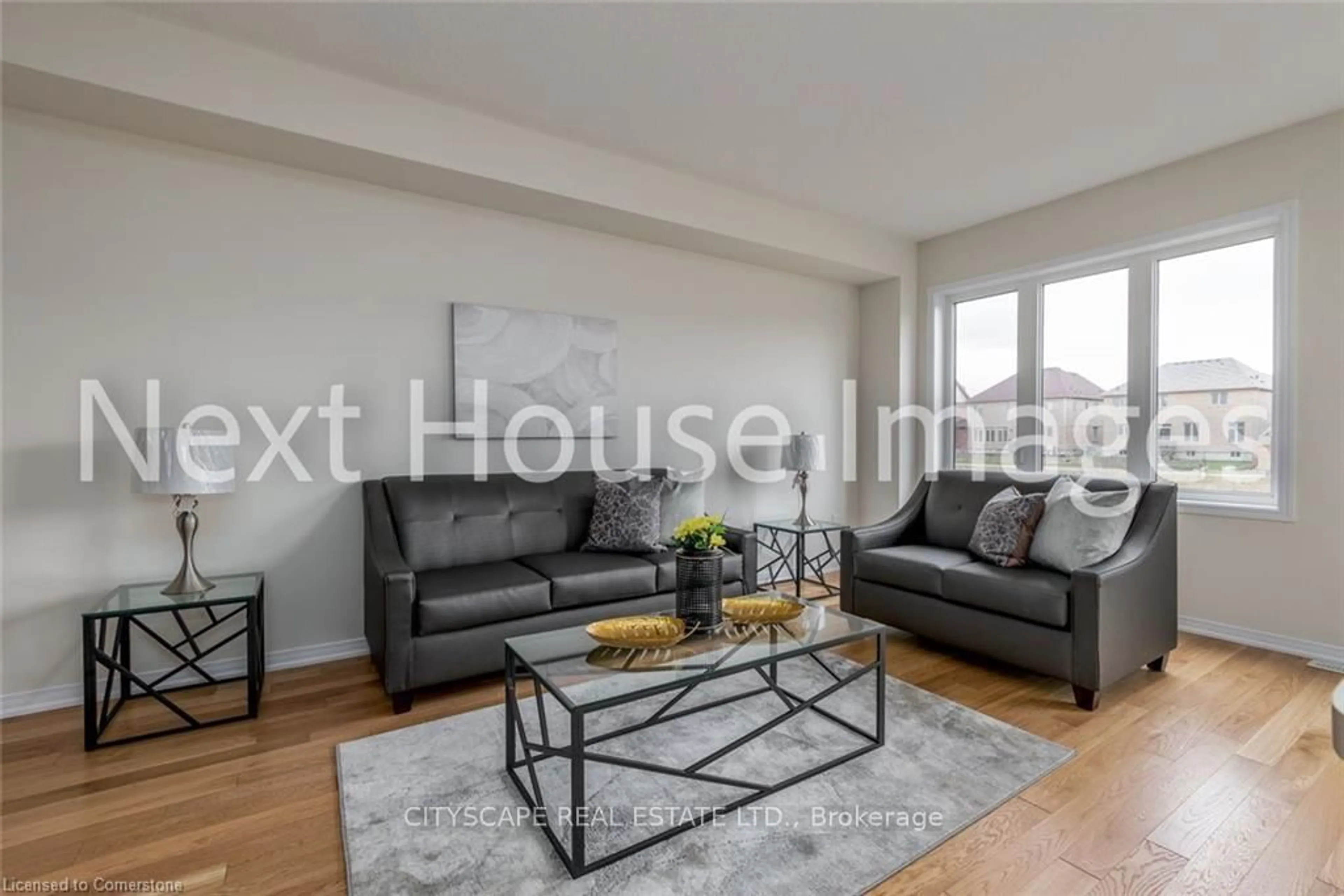 Living room with furniture, wood/laminate floor for 8317 Mulberry Dr #12, Niagara Falls Ontario L2H 3S9