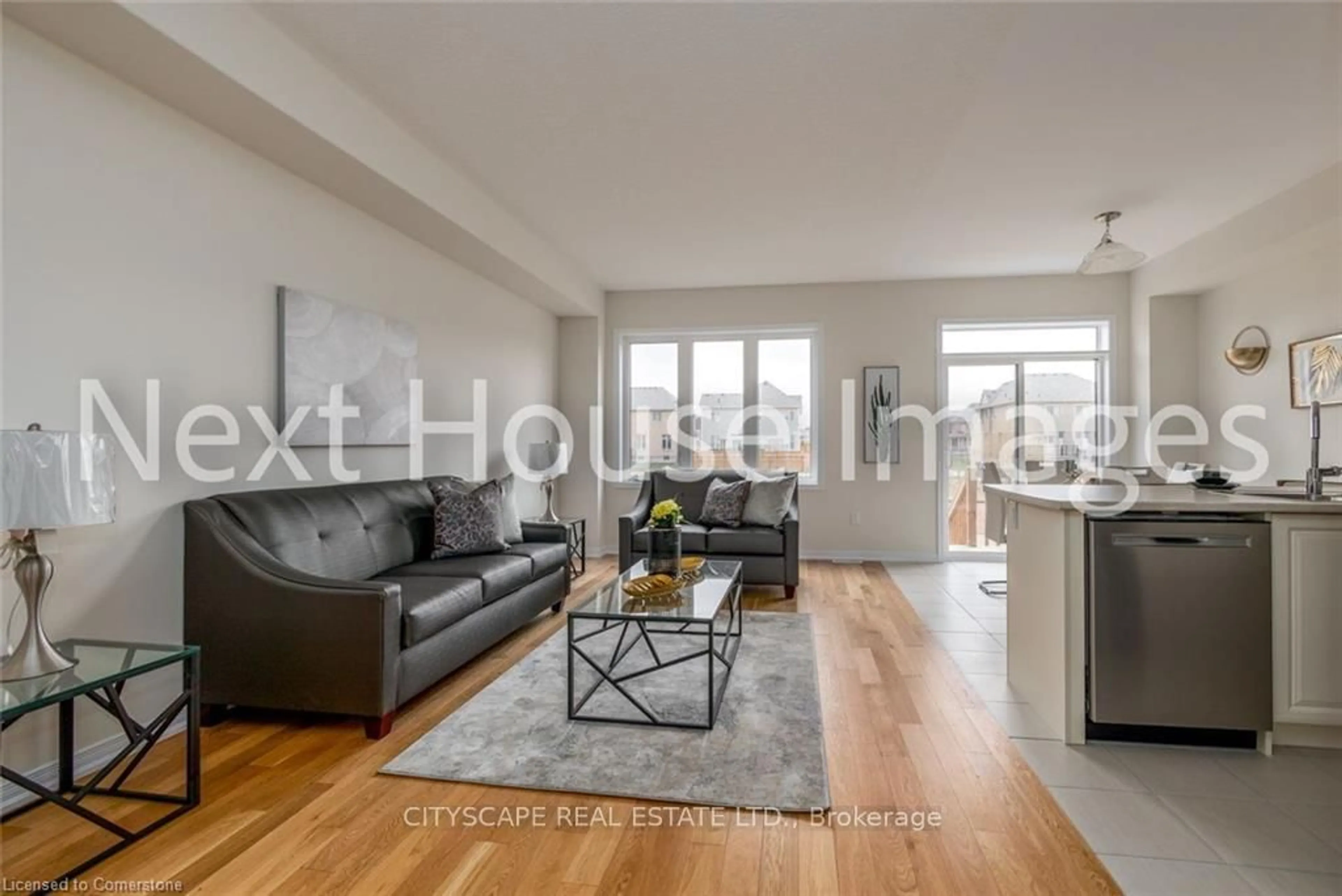 Living room with furniture, wood/laminate floor for 8317 Mulberry Dr #12, Niagara Falls Ontario L2H 3S9