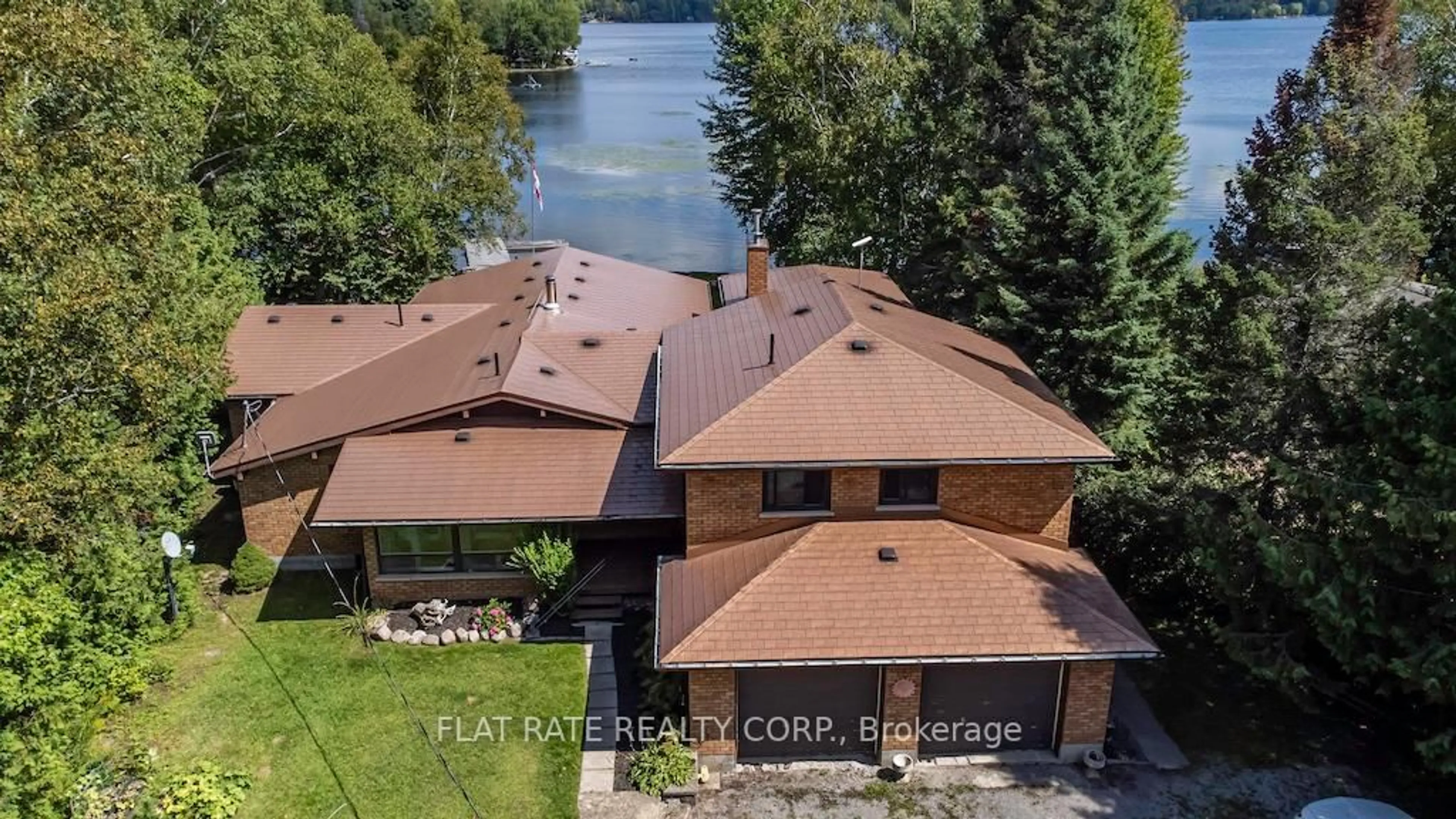 A pic from outside/outdoor area/front of a property/back of a property/a pic from drone, water/lake/river/ocean view for 135 Melody Bay Rd, Trent Lakes Ontario K0L 2H0