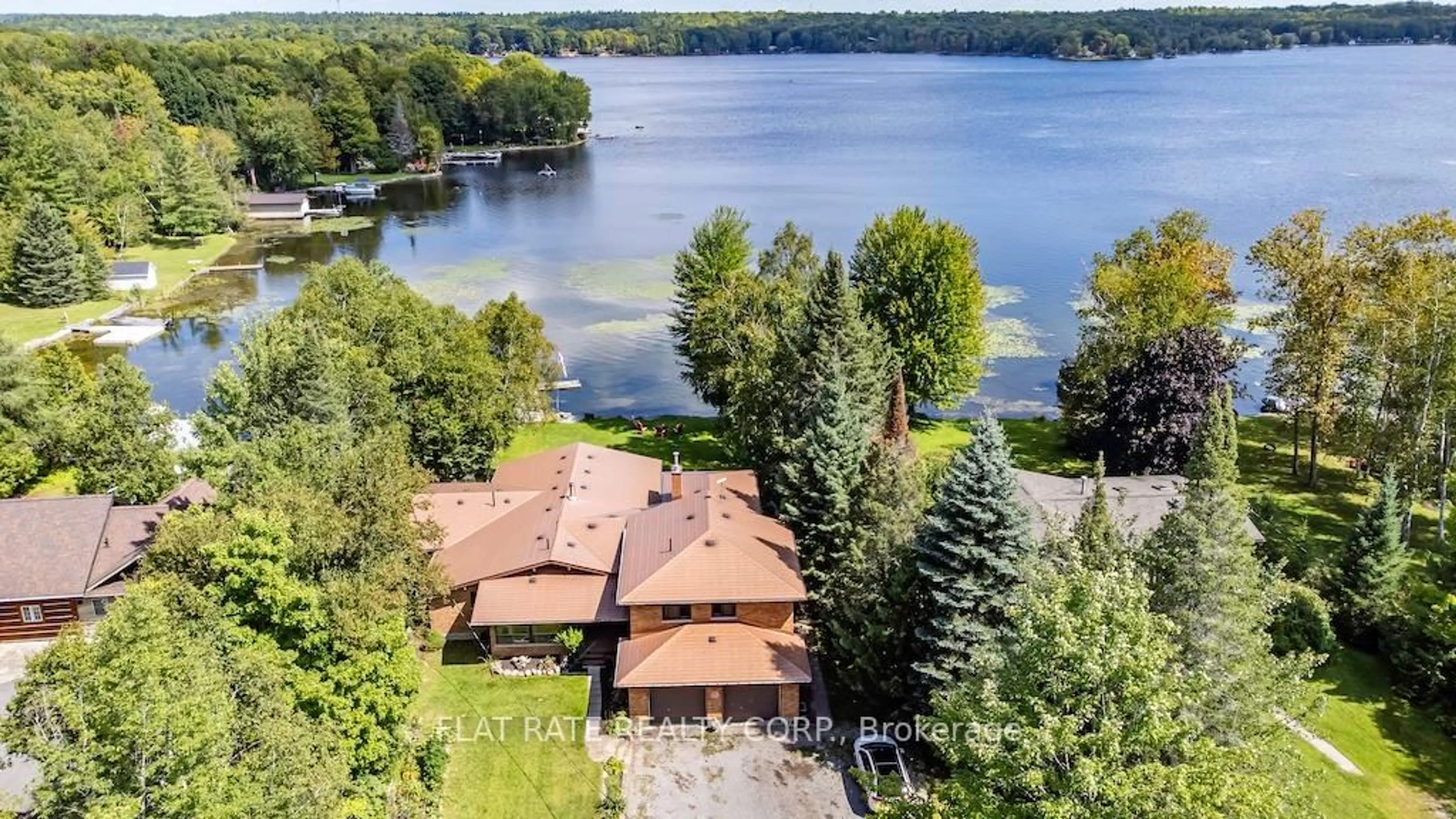 A pic from outside/outdoor area/front of a property/back of a property/a pic from drone, water/lake/river/ocean view for 135 Melody Bay Rd, Trent Lakes Ontario K0L 2H0