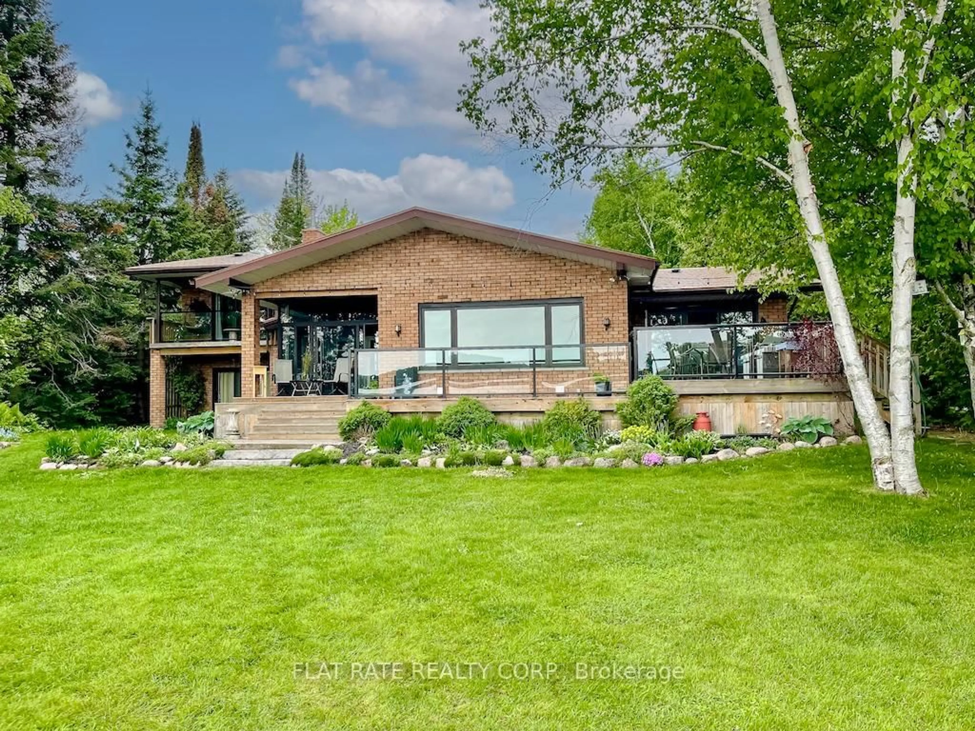 Home with brick exterior material, water/lake/river/ocean view for 135 Melody Bay Rd, Trent Lakes Ontario K0L 2H0