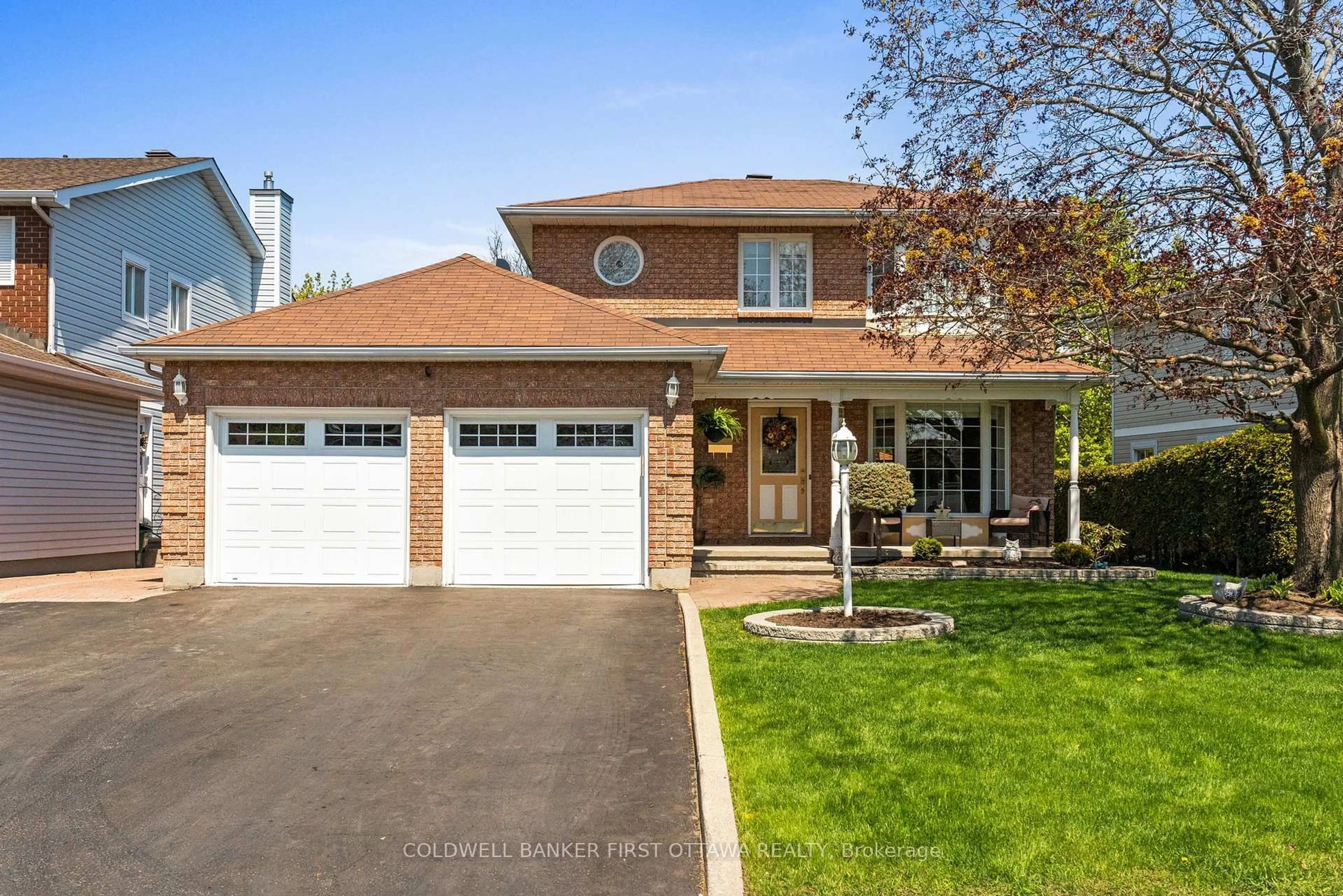 Home with brick exterior material, street for 64 Tartan Dr, Barrhaven Ontario K2J 2V6