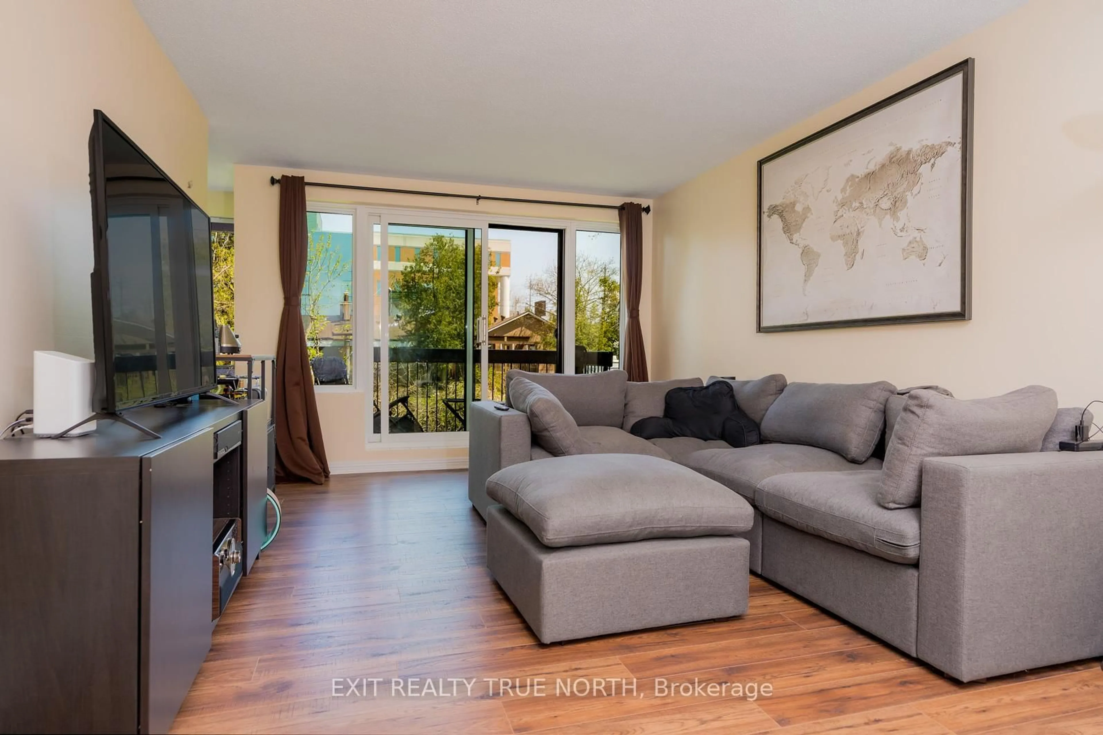 Living room with furniture, wood/laminate floor for 850 6th St #204, Owen Sound Ontario N4K 6T7