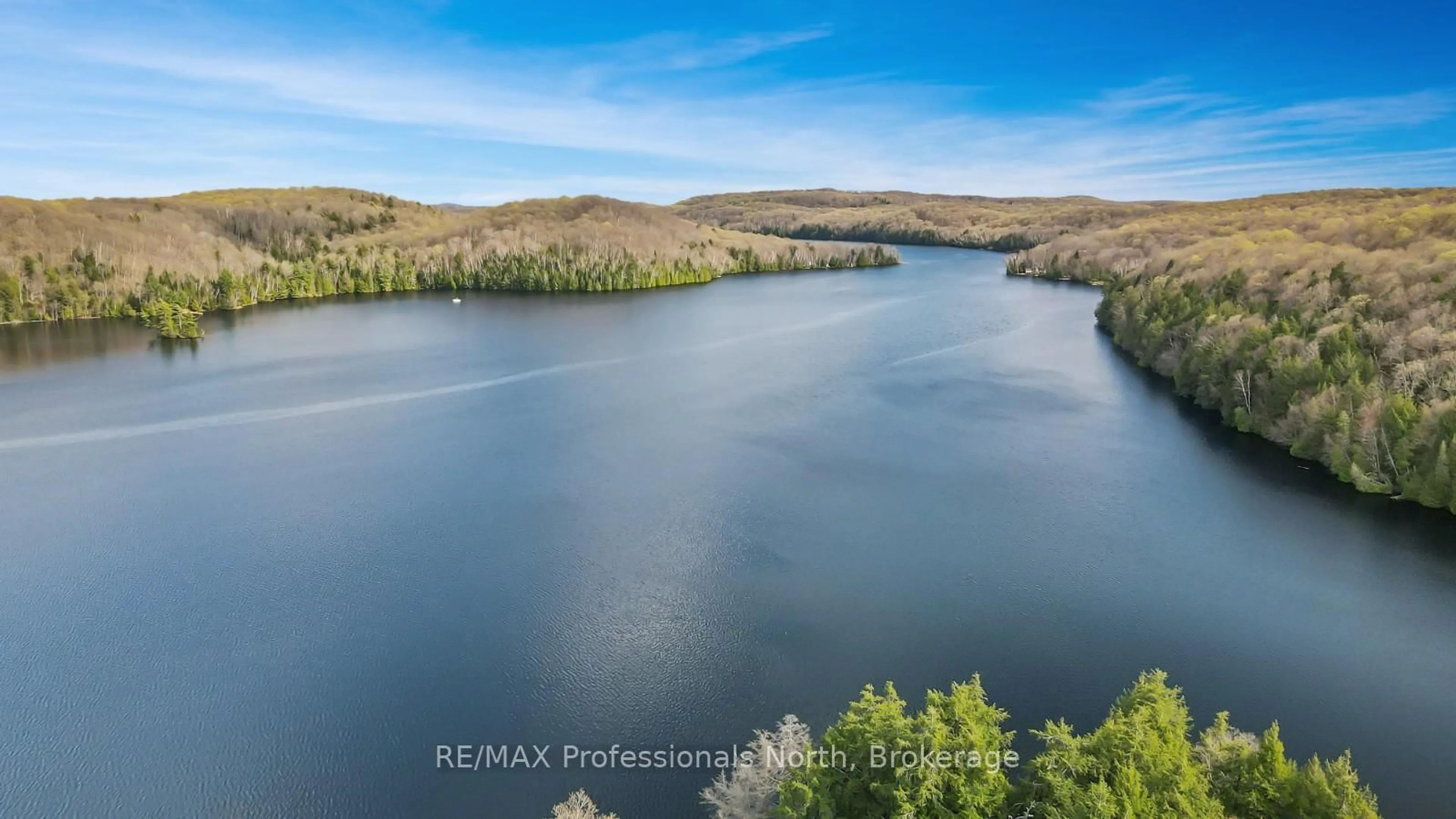 A pic from outside/outdoor area/front of a property/back of a property/a pic from drone, water/lake/river/ocean view for 1334 Hardwood Lane, Highlands East Ontario K0M 3C0