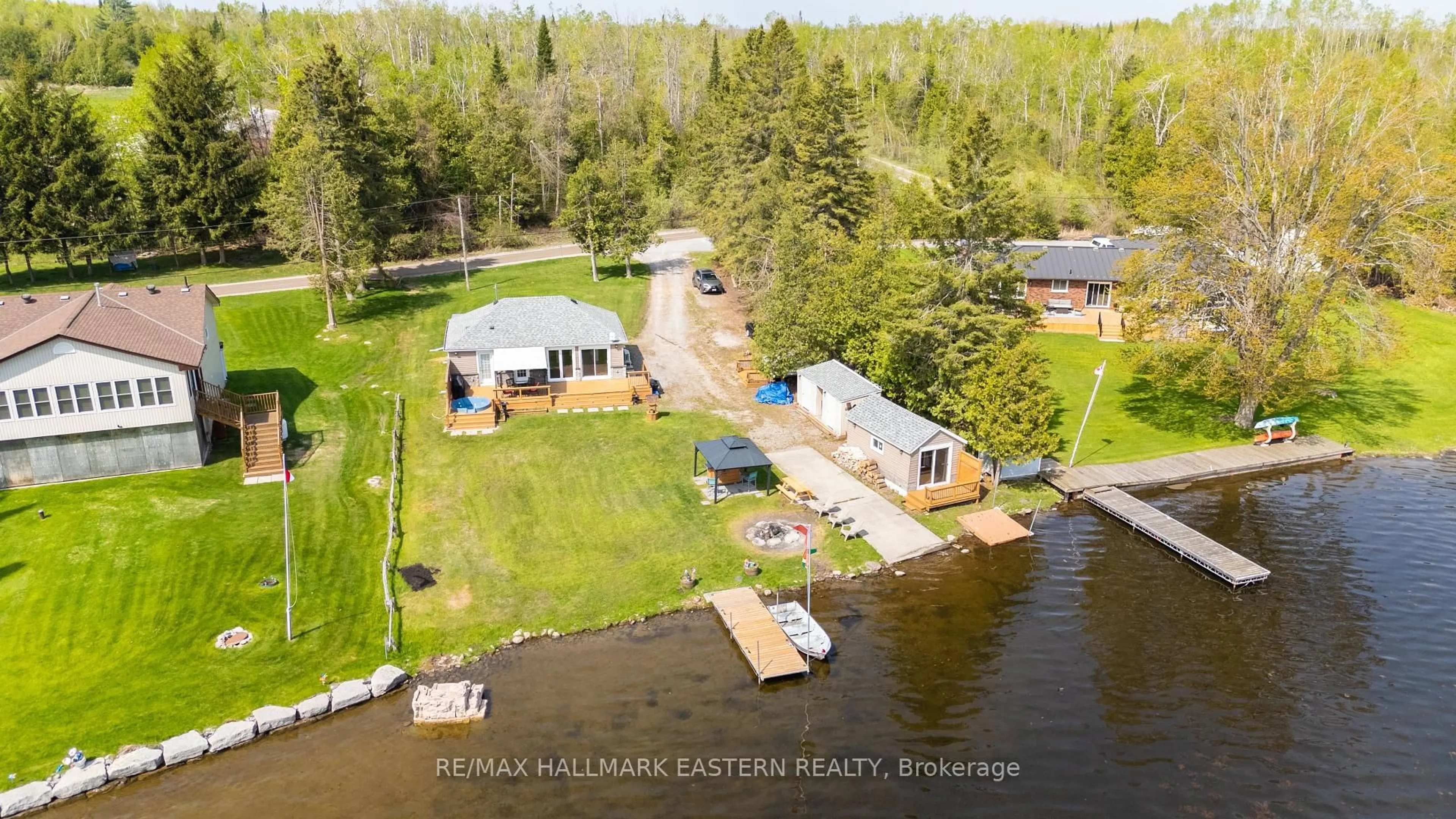 A pic from outside/outdoor area/front of a property/back of a property/a pic from drone, water/lake/river/ocean view for 1481 Shannon Dr, Selwyn Ontario K0L 1T0