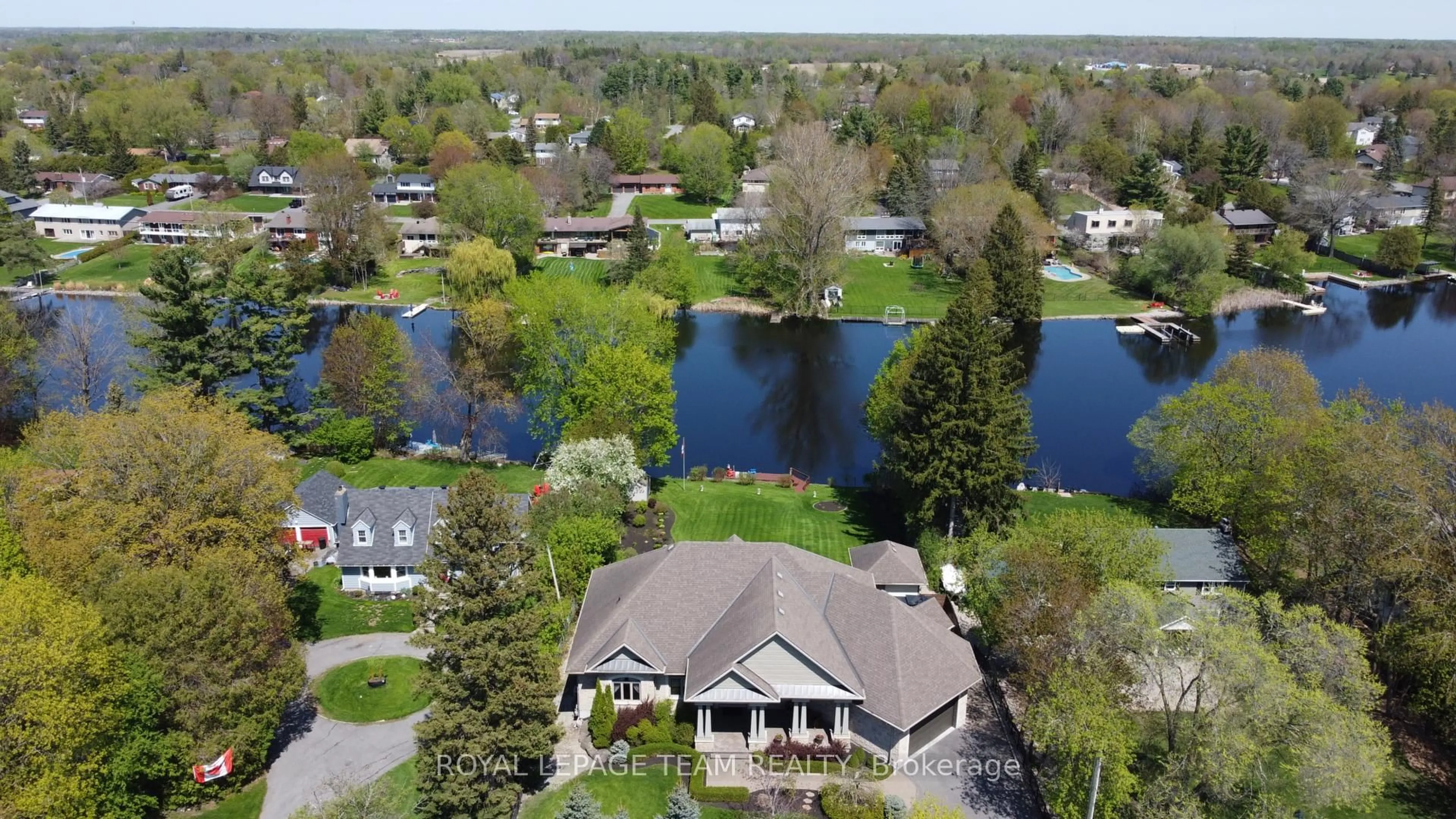 A pic from outside/outdoor area/front of a property/back of a property/a pic from drone, water/lake/river/ocean view for 5591 Manotick Main St, Ottawa Ontario K4M 1A4
