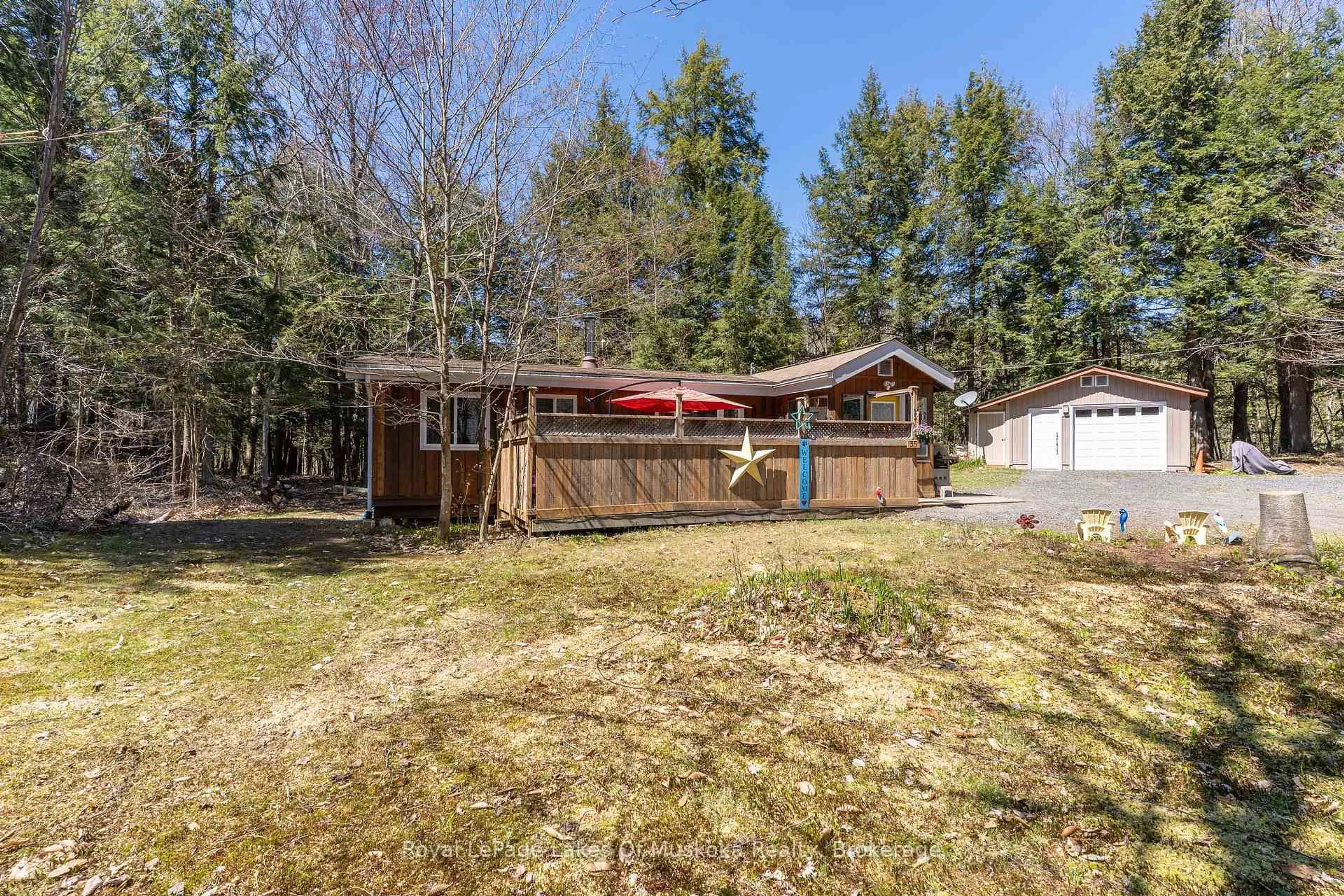 A pic from outside/outdoor area/front of a property/back of a property/a pic from drone, forest/trees view for 35 Brennan Circ, Huntsville Ontario P1H 2J2