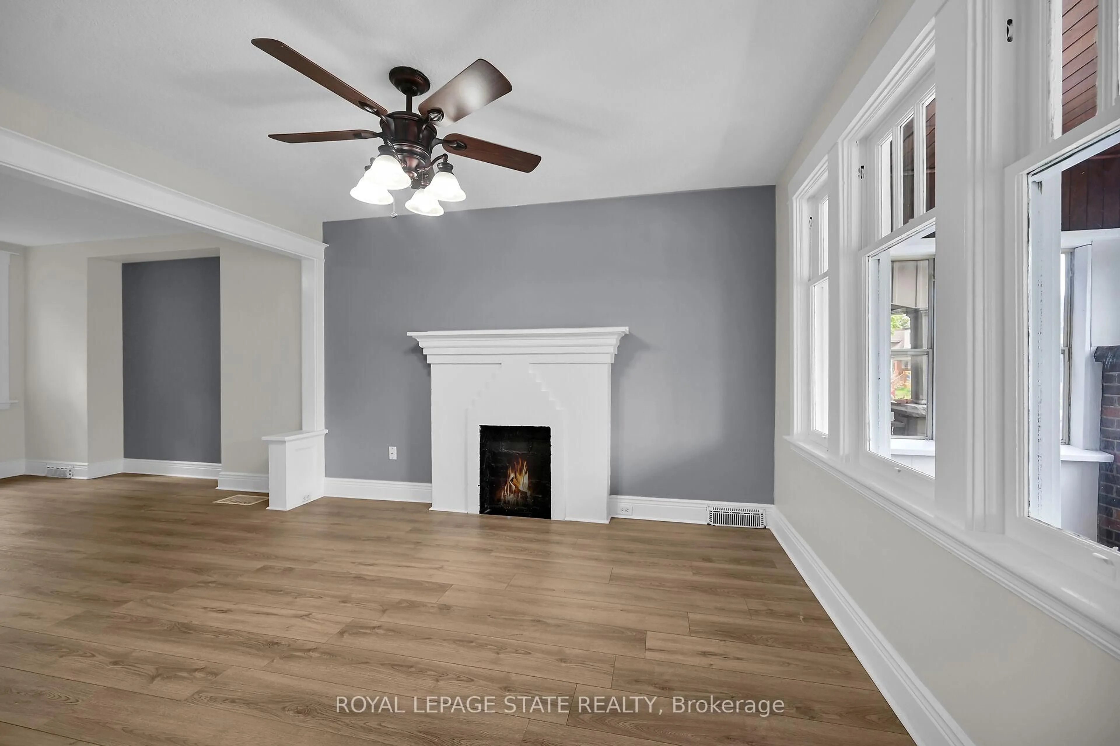 Living room with furniture, wood/laminate floor for 35 Edgemont St, Hamilton Ontario L8H 4C7