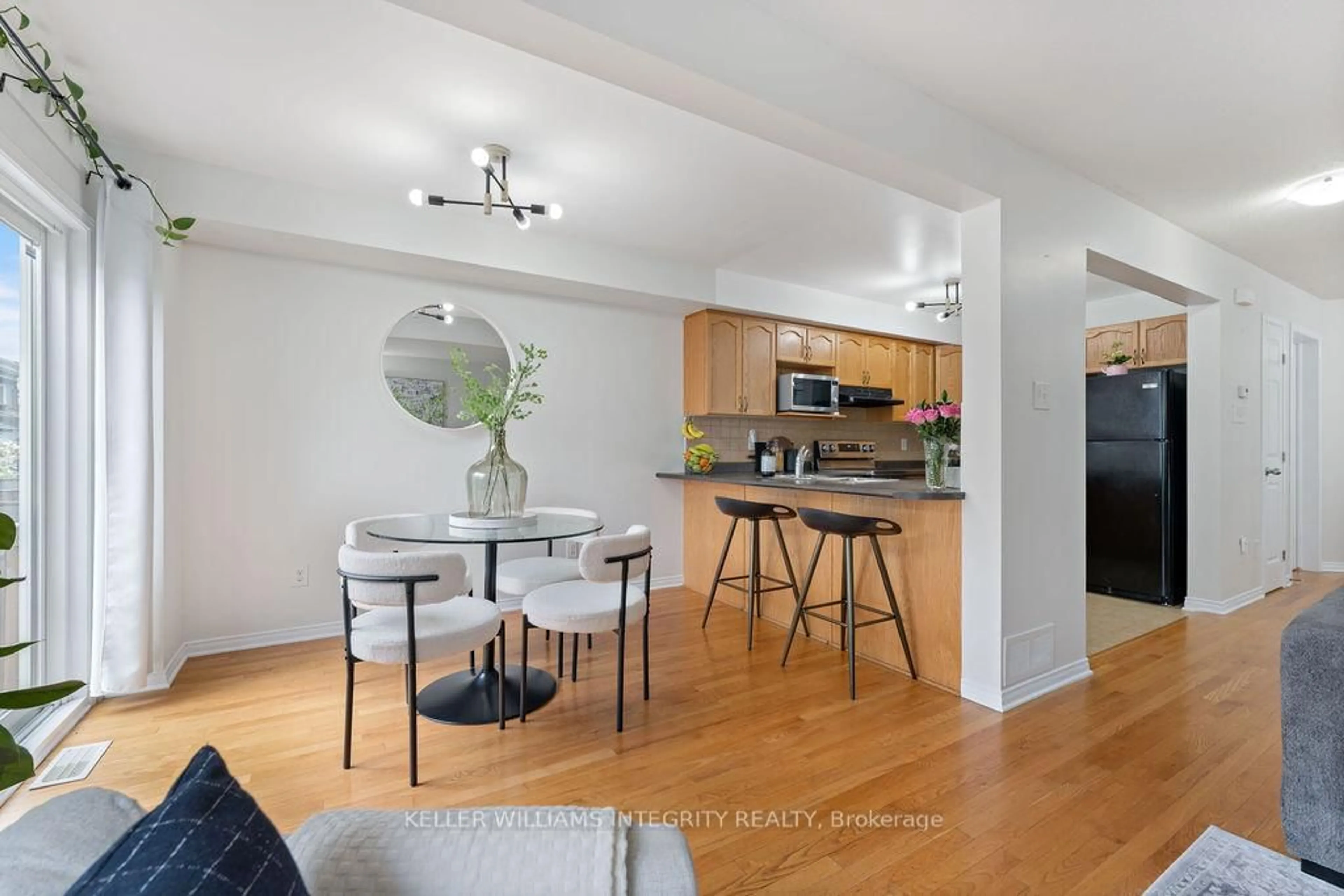 Open concept kitchen, wood/laminate floor for 247 Opus St, Ottawa Ontario K2S 0J1