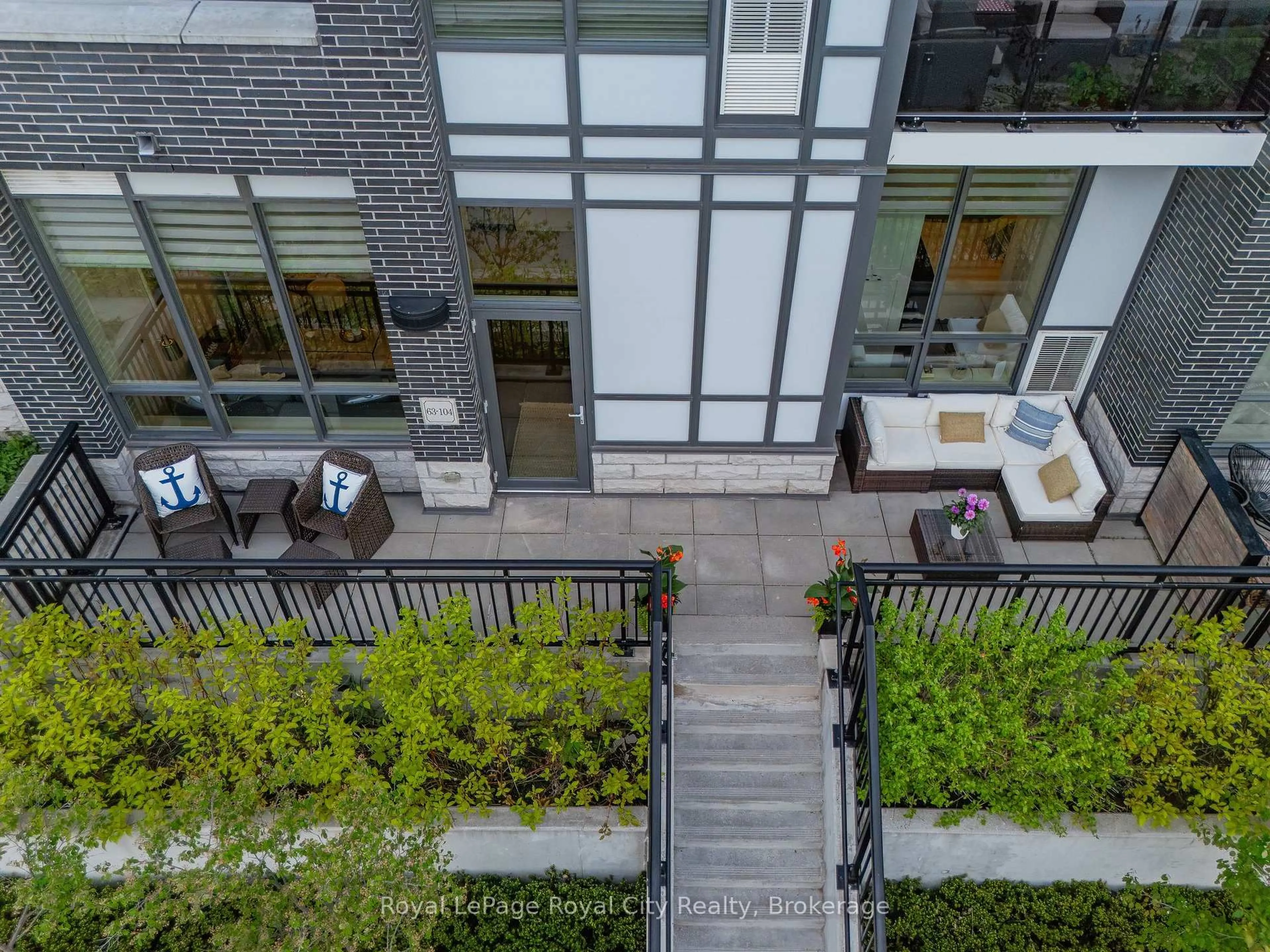 Patio, city buildings view from balcony for 63 ARTHUR St #104, Guelph Ontario N1E 0A3