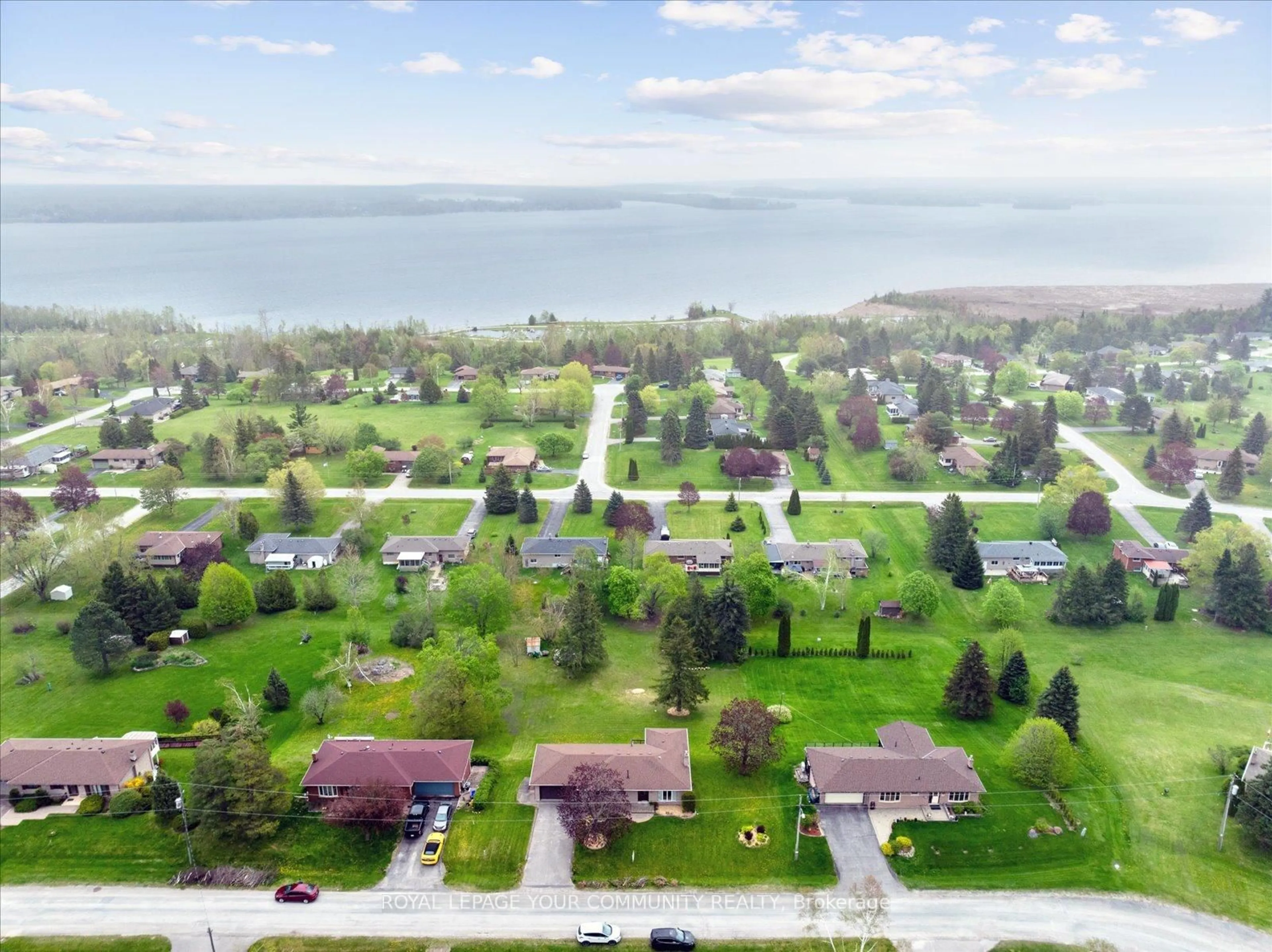 A pic from outside/outdoor area/front of a property/back of a property/a pic from drone, water/lake/river/ocean view for 381 Country Club Circ, Kawartha Lakes Ontario K0M 1A0